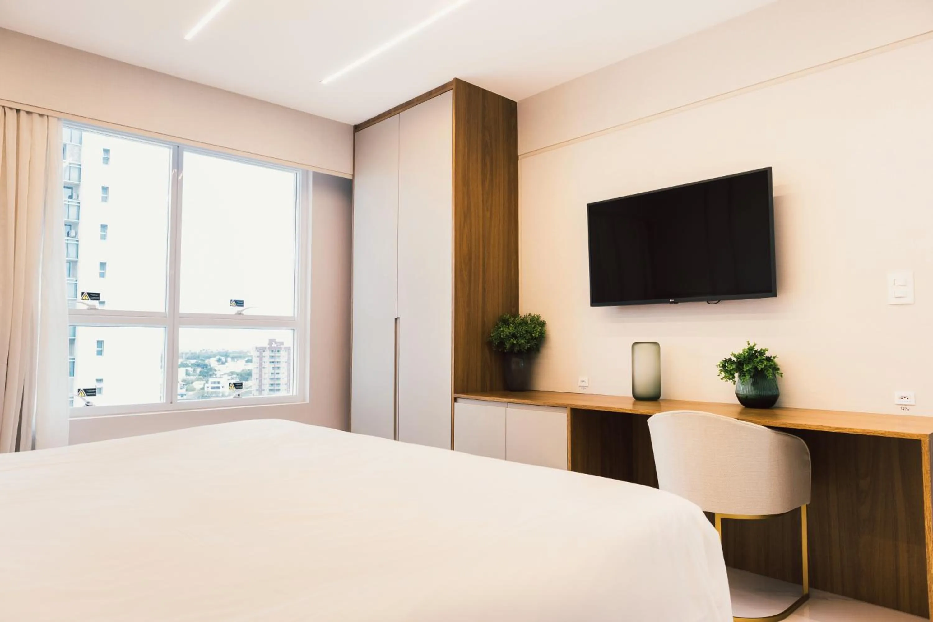 Bed in Ramada Hotel & Suites Campos Pelinca