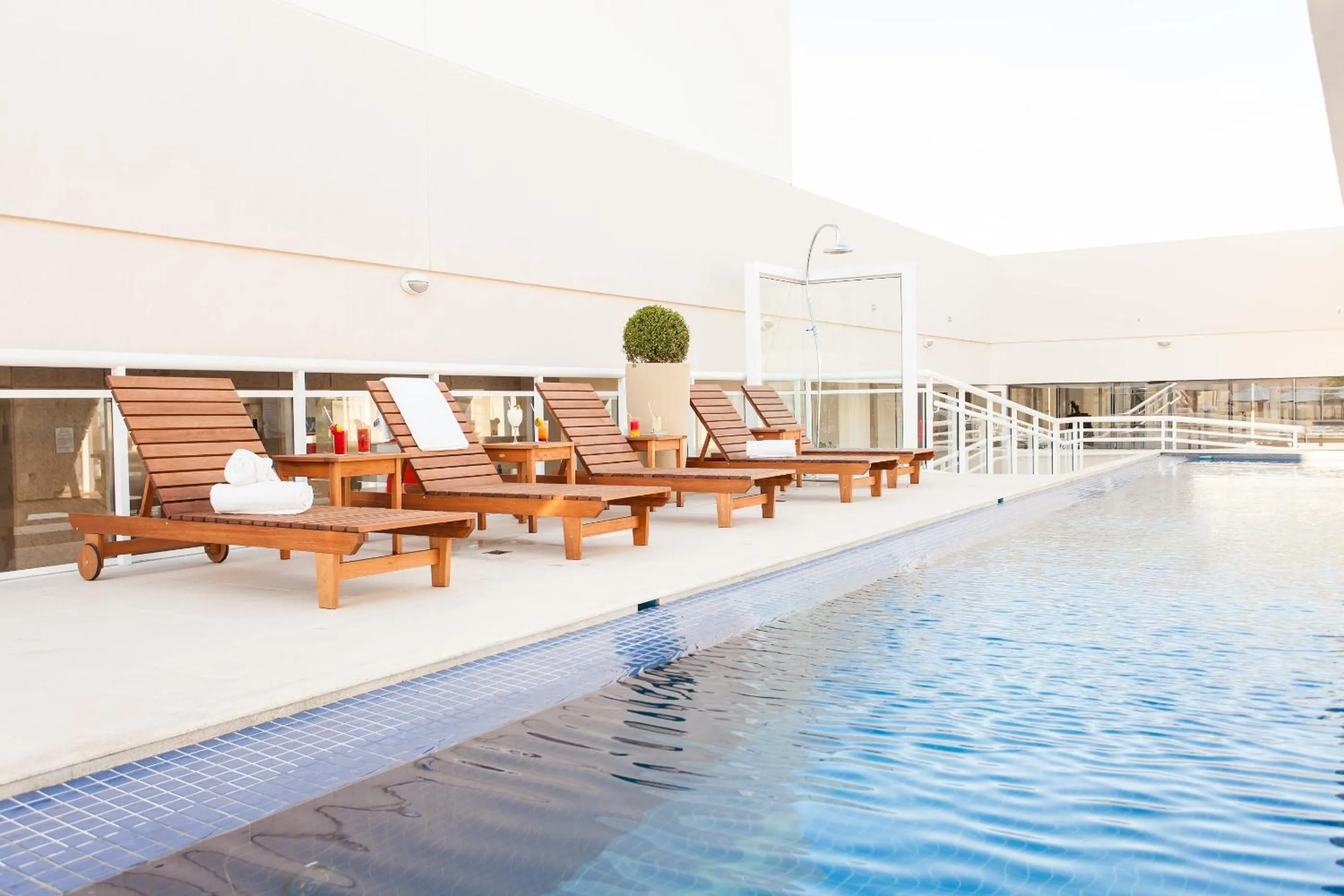 Swimming pool in Ramada Hotel & Suites Campos Pelinca