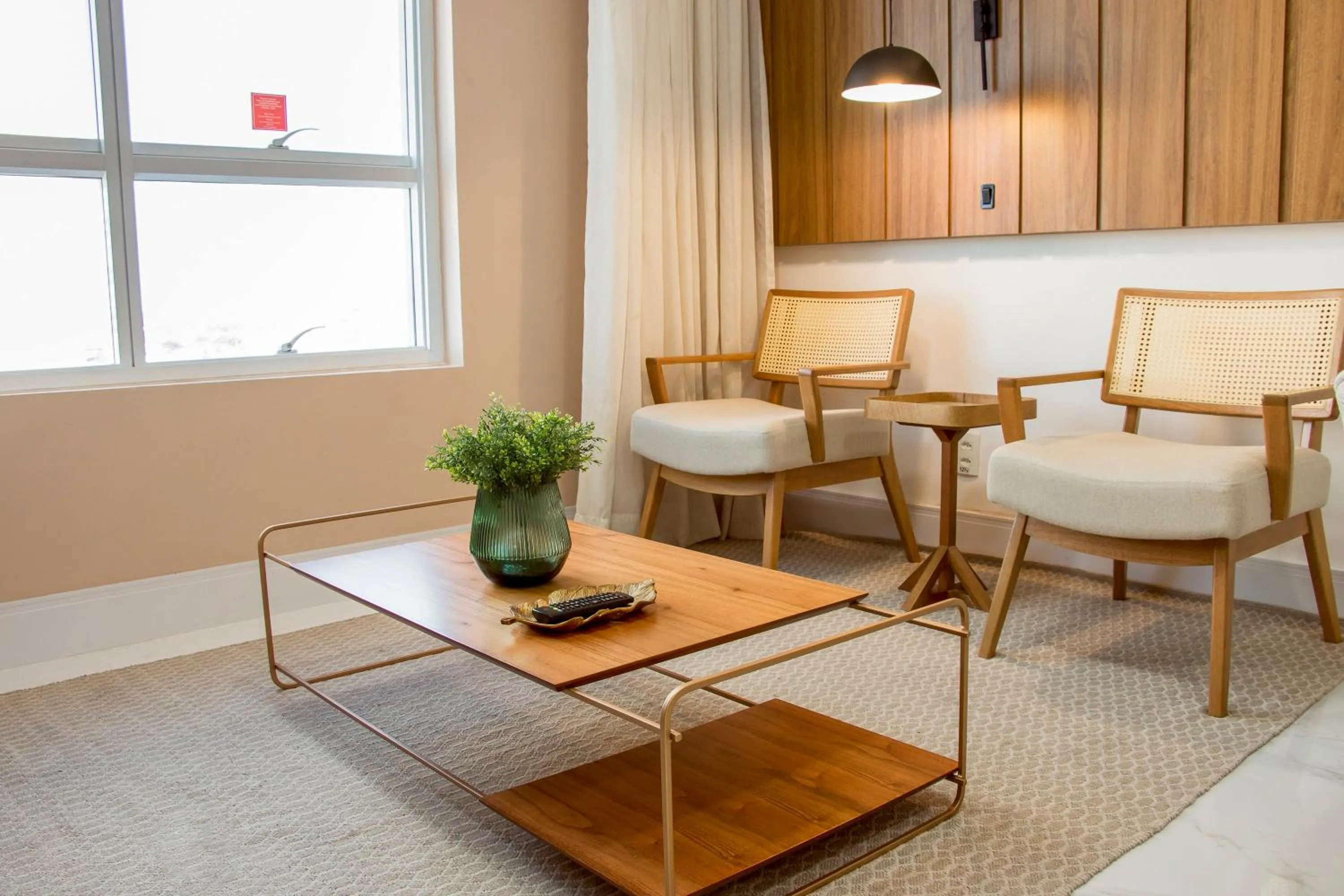 Living room in Ramada Hotel & Suites Campos Pelinca