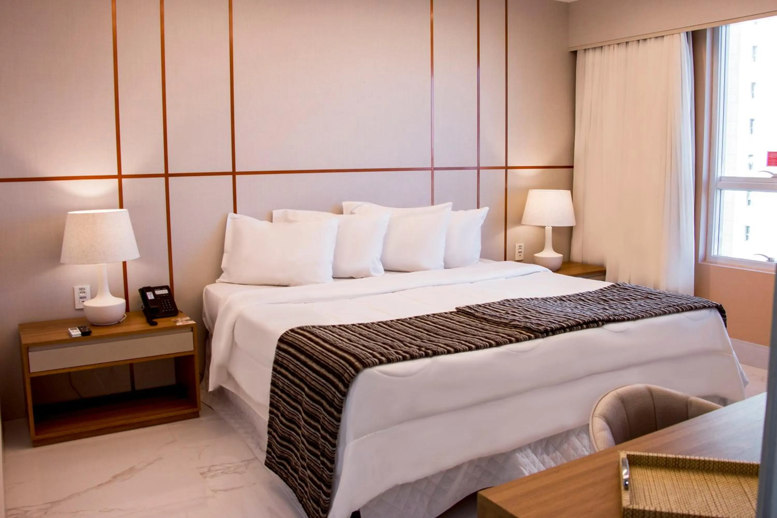 Photo of the whole room, Bed in Ramada Hotel & Suites Campos Pelinca