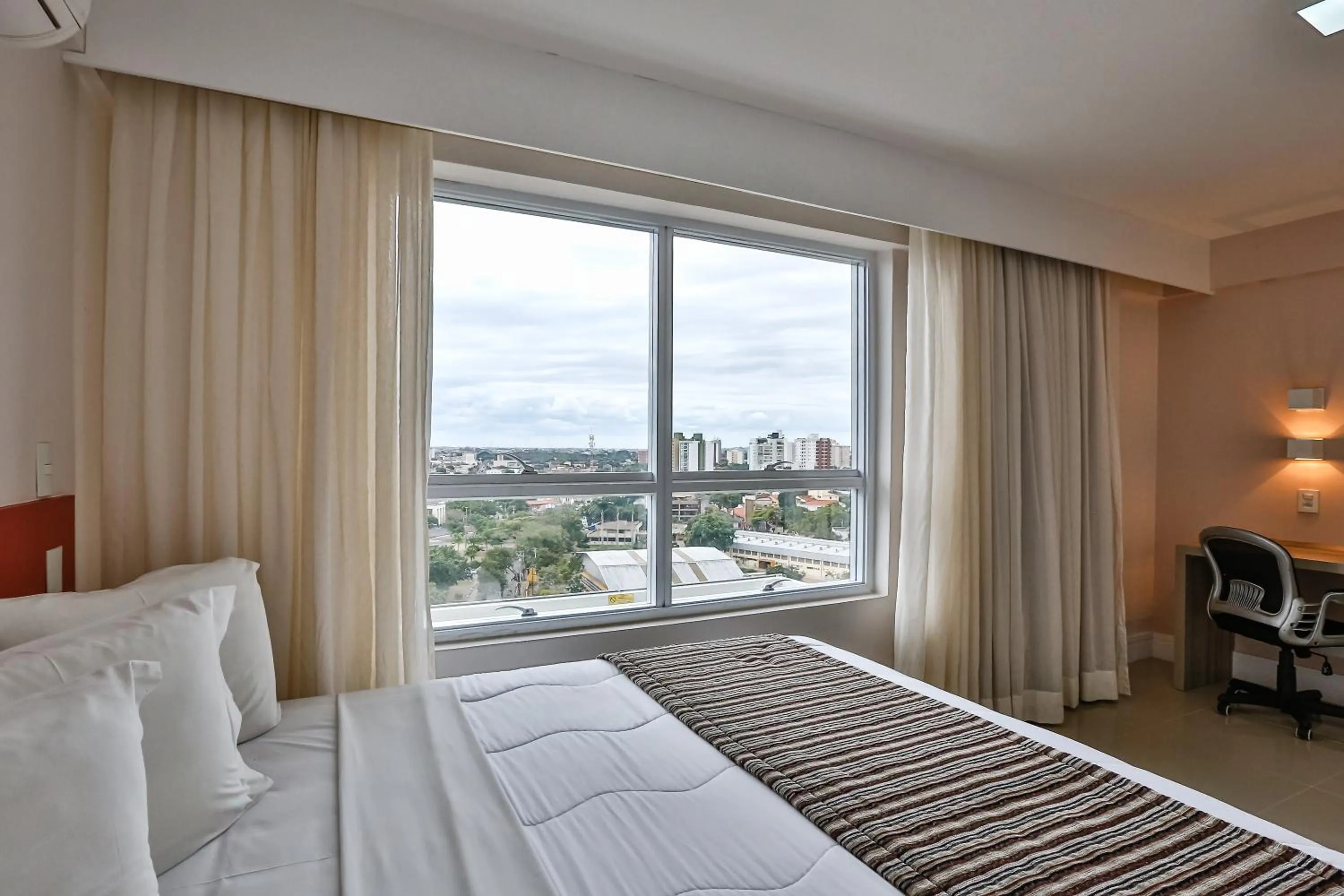Photo of the whole room, Bed in Ramada Hotel & Suites Campos Pelinca