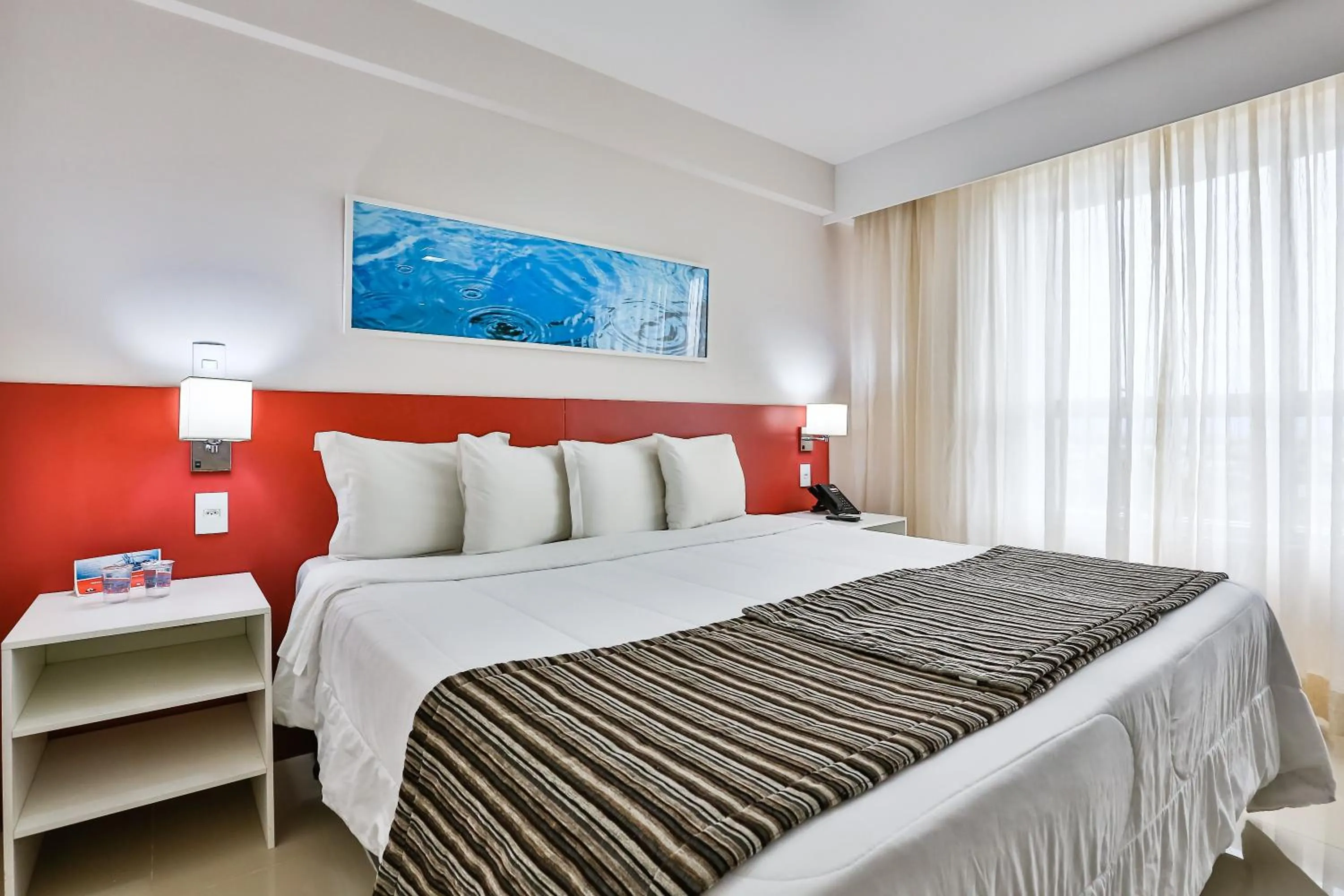 Bed in Ramada Hotel & Suites Campos Pelinca