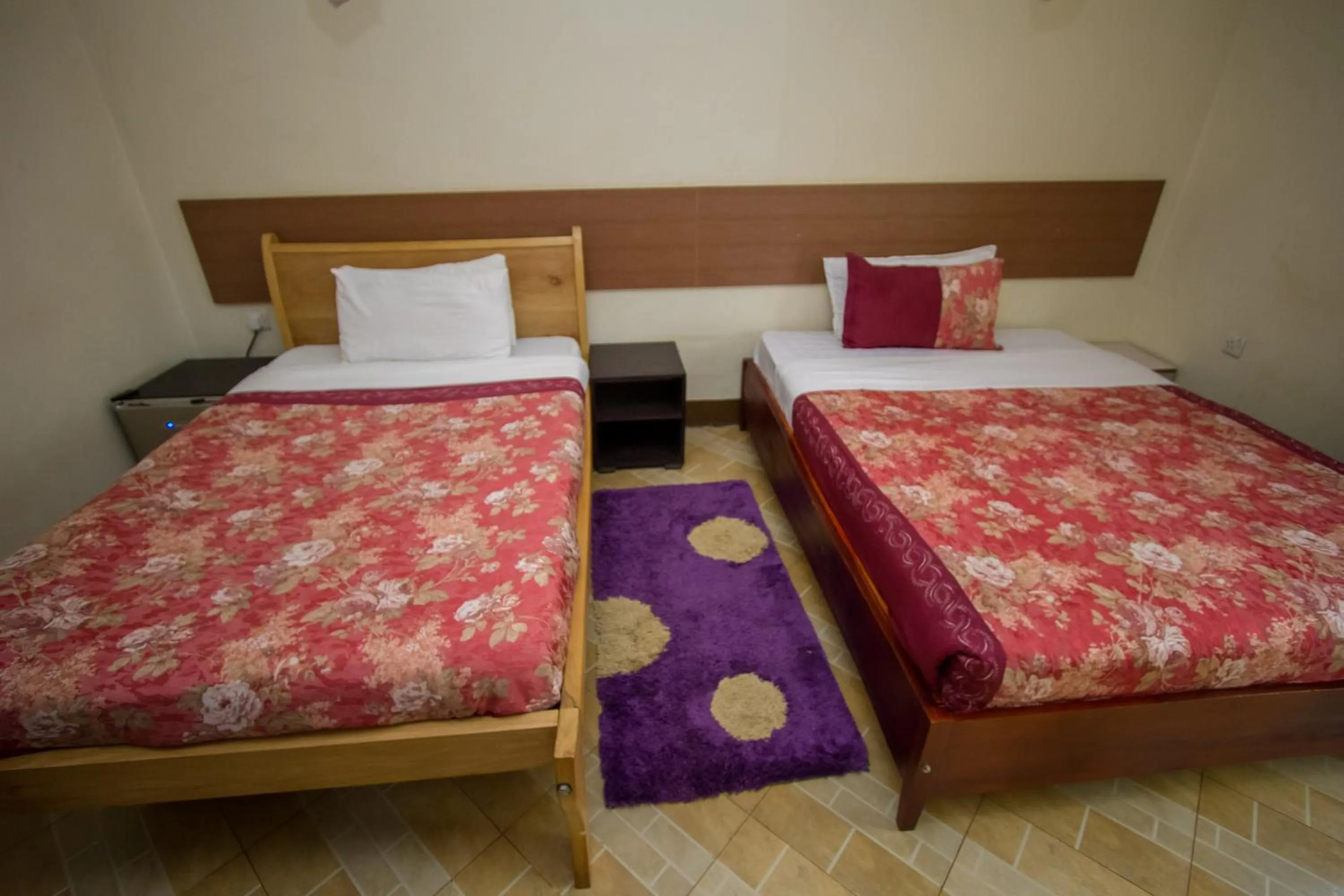 Bed in Grand Global Hotel