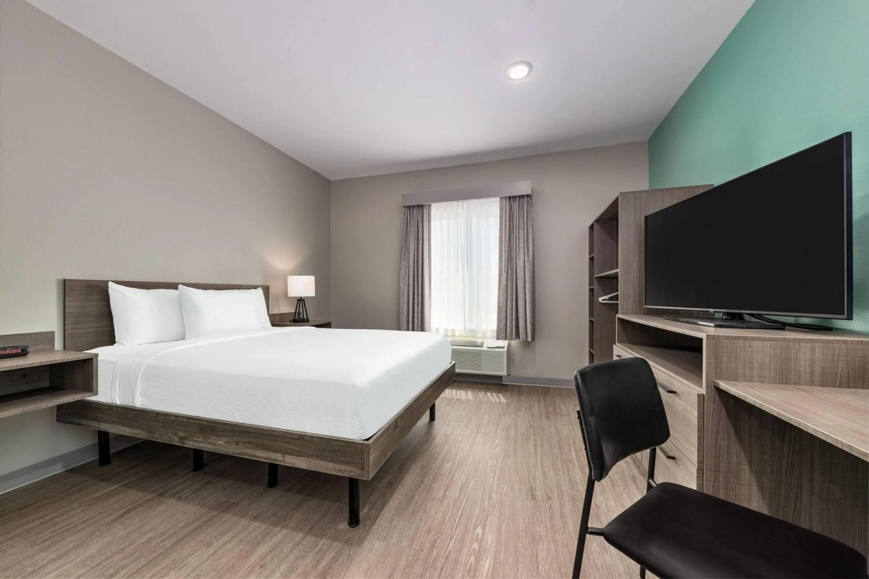 Photo of the whole room, Bed in ECHO Suites Extended Stay by Wyndham Dallas Plano Richardson