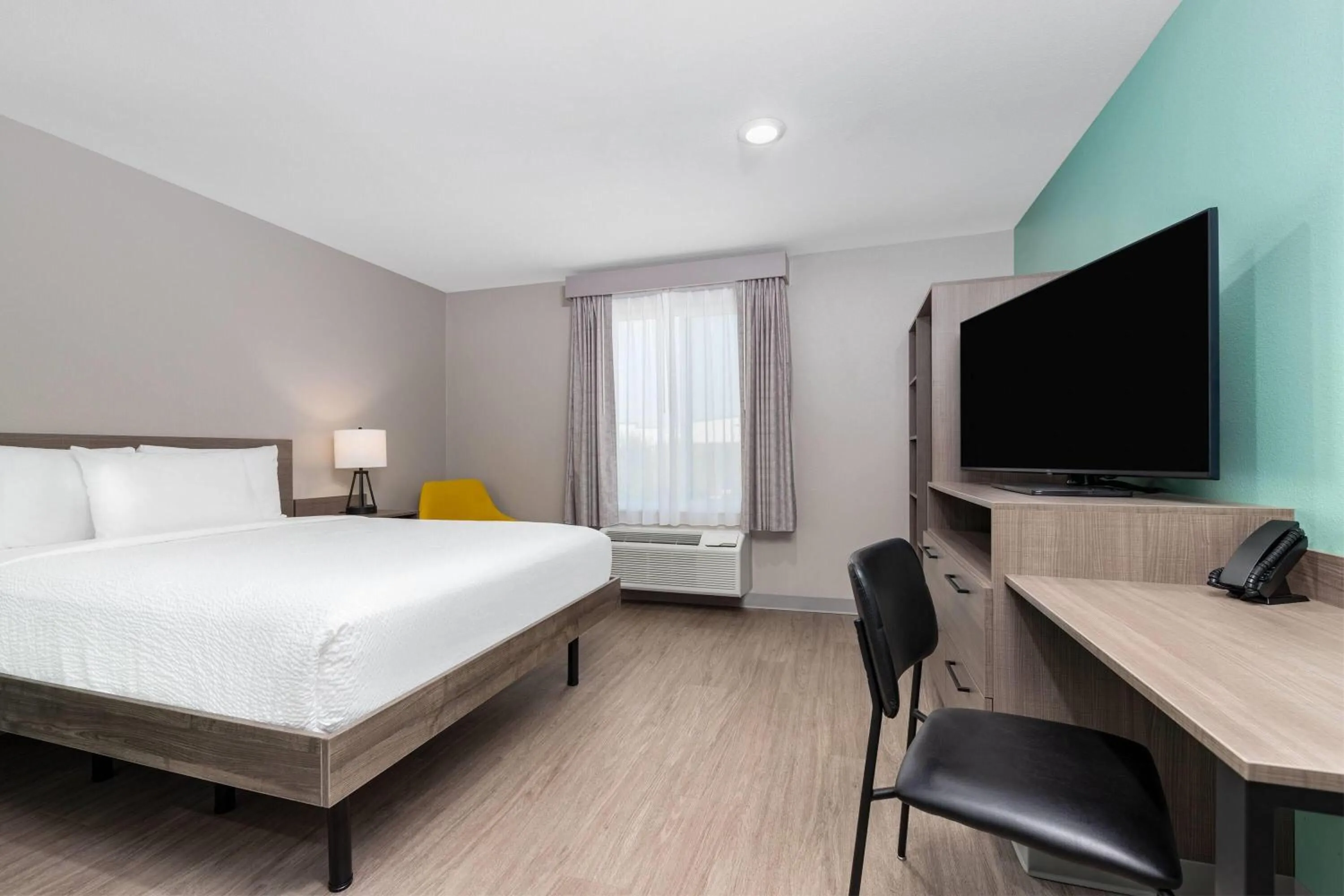 Photo of the whole room, Bed in ECHO Suites Extended Stay by Wyndham Dallas Plano Richardson