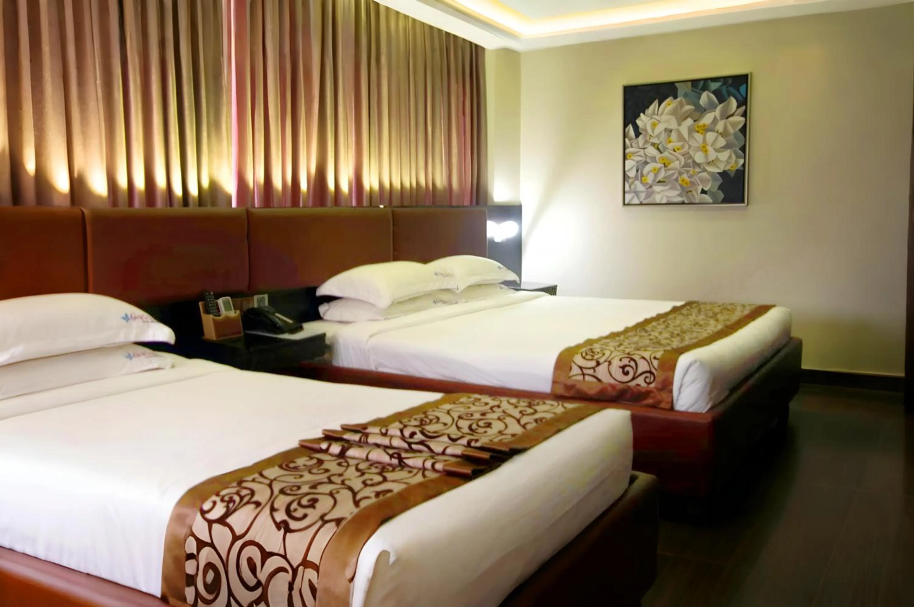 Bed in D'more Dhaka Hotel & Resort