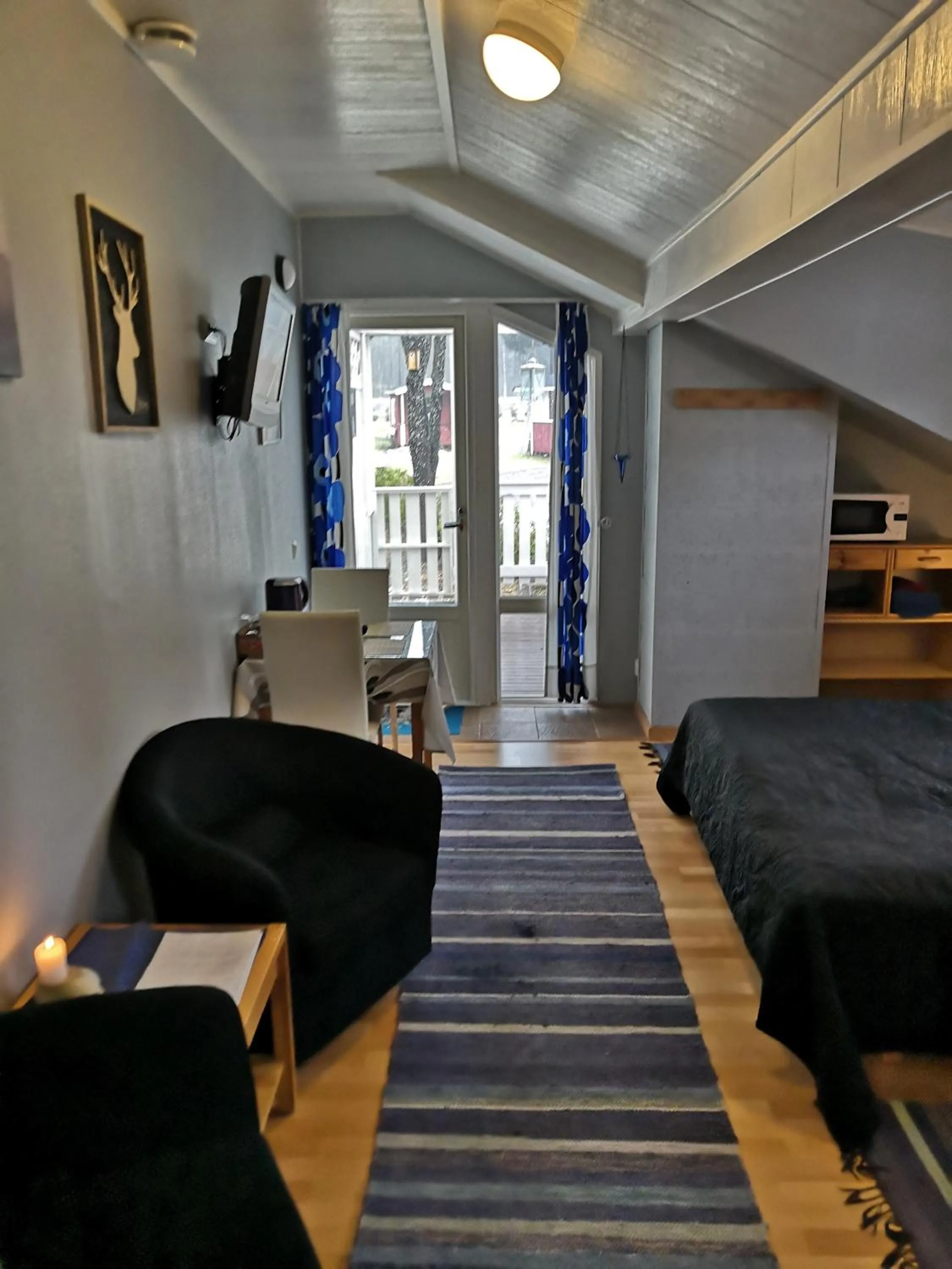 Living room, Bed in Hostel Mansikka