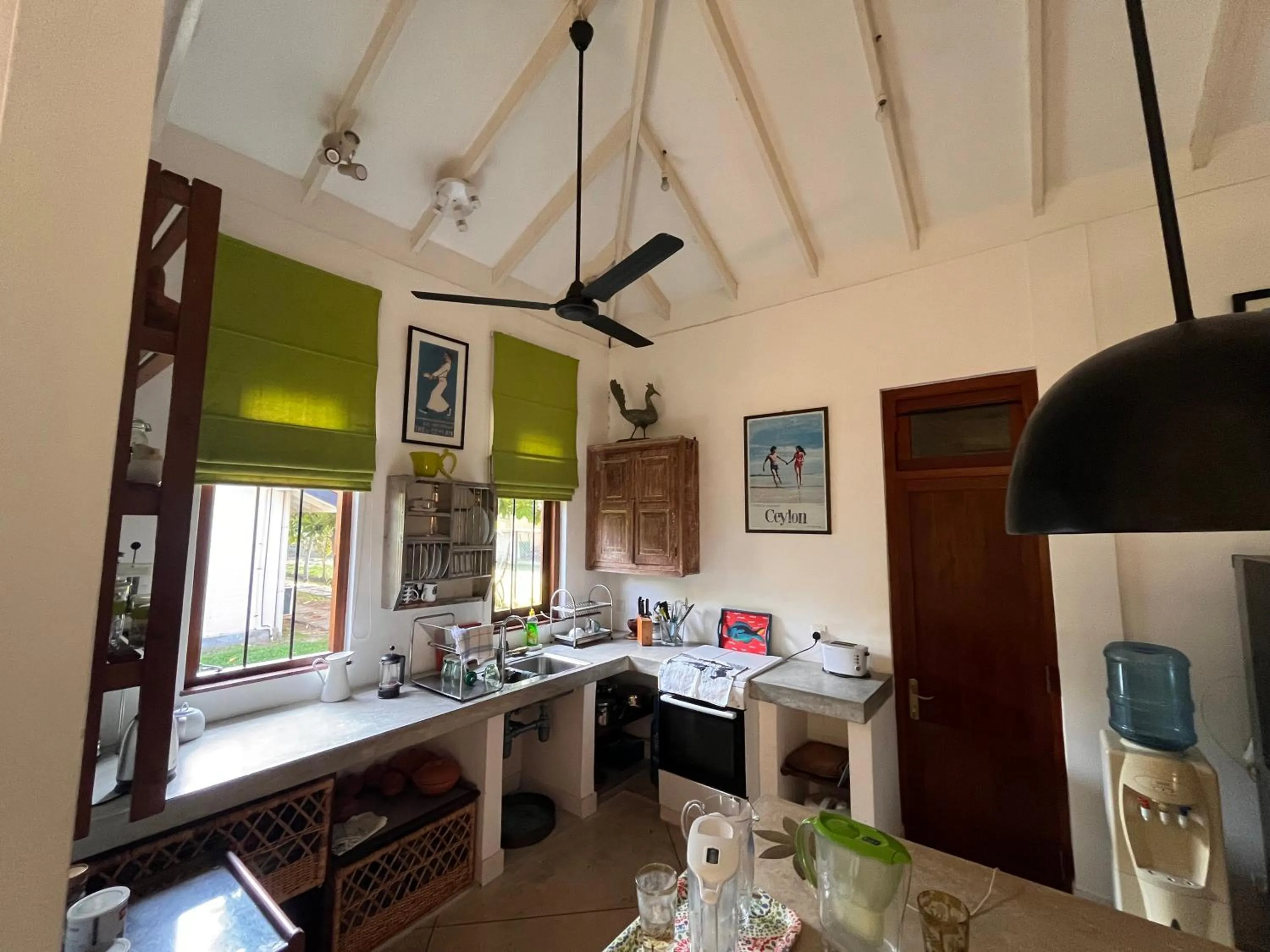 Kitchen or kitchenette in Calamansi Cove Villas