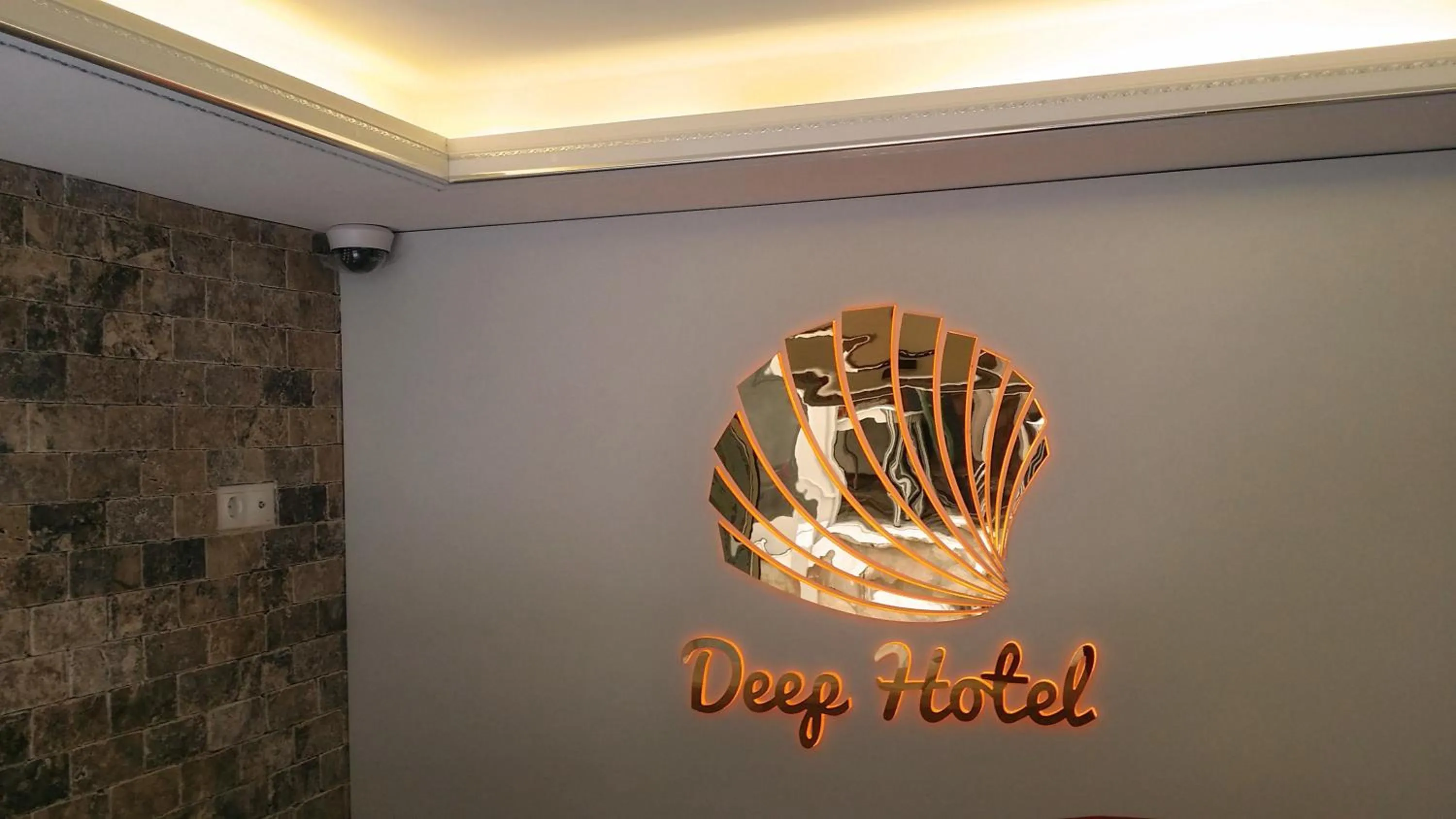 Property logo or sign in Deep Hotel