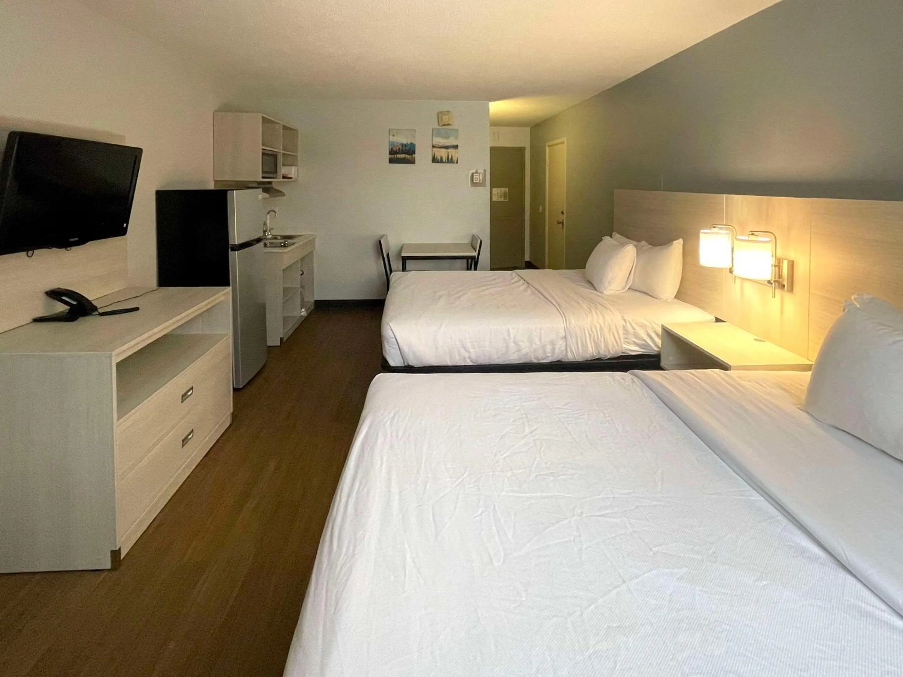 Bed in Suburban Studios East Syracuse Carrier Circle