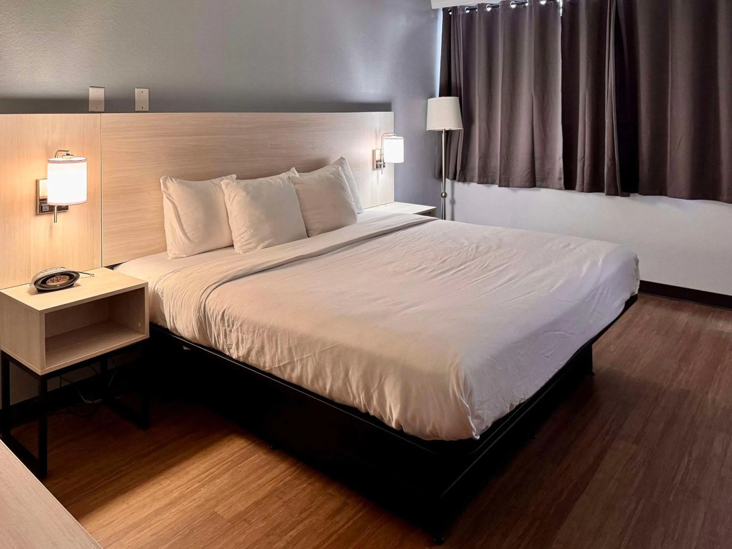 Bed in Suburban Studios East Syracuse Carrier Circle