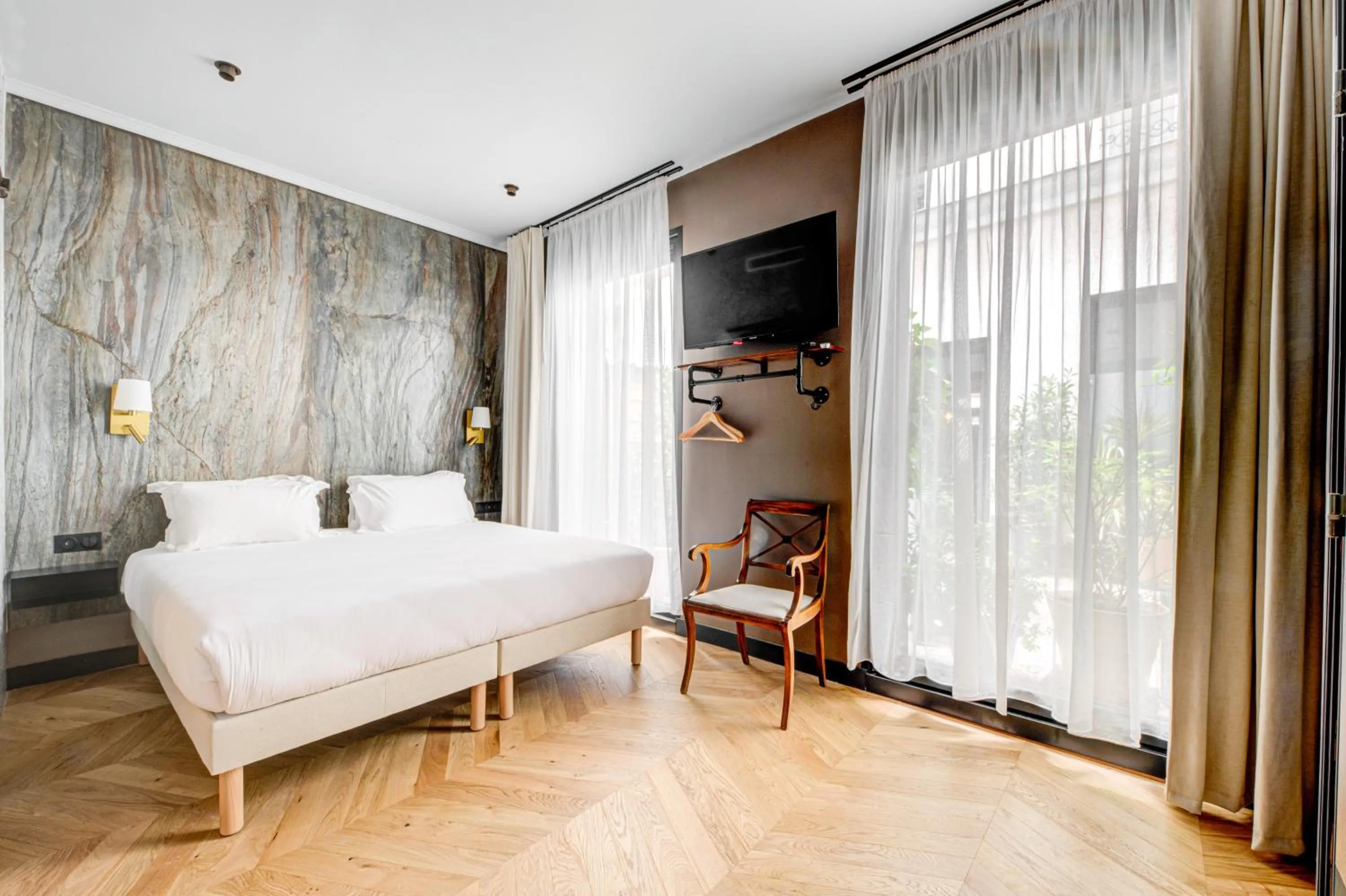 Bed in Hôtel Maât Batignolles