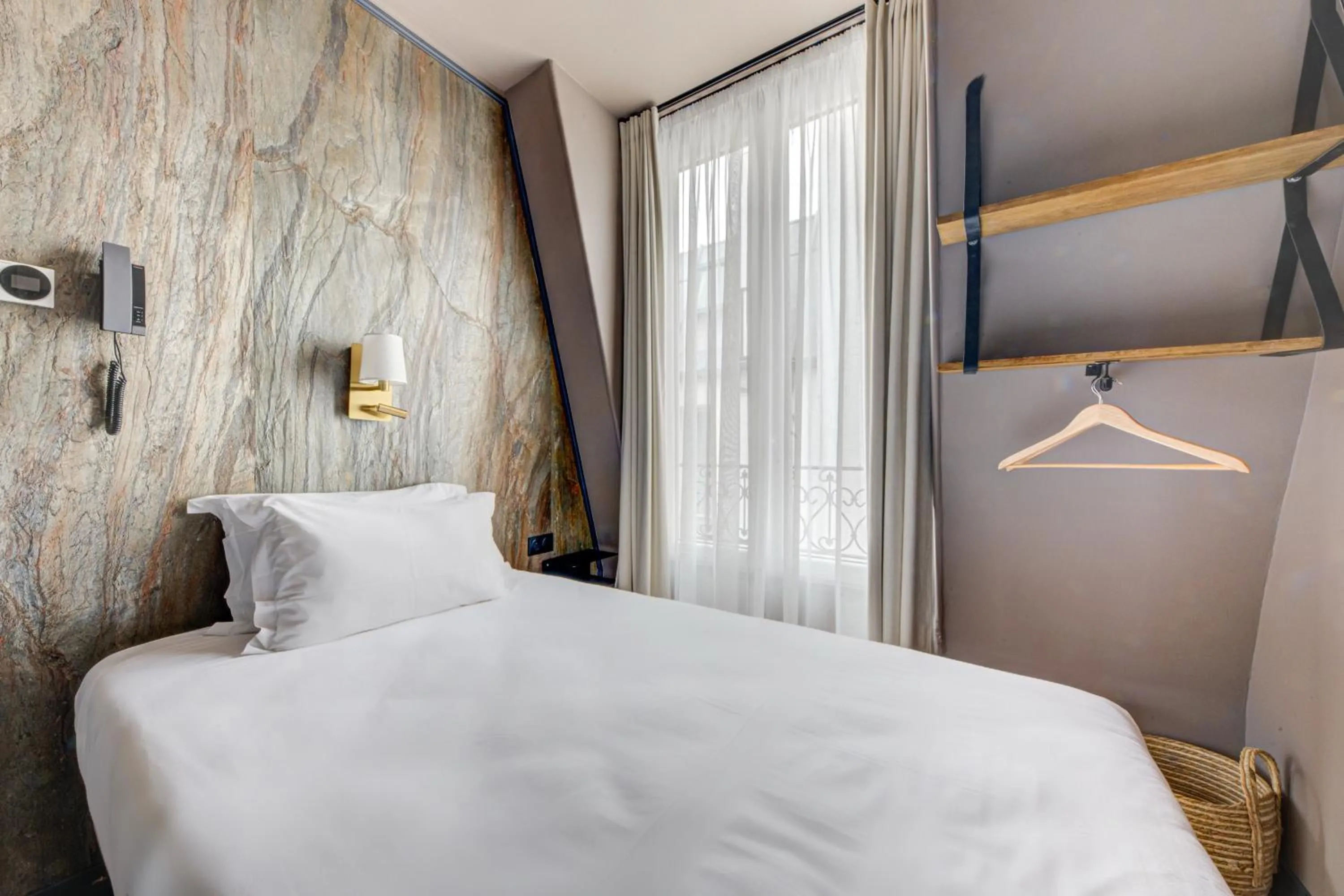 Bed in Hôtel Maât Batignolles