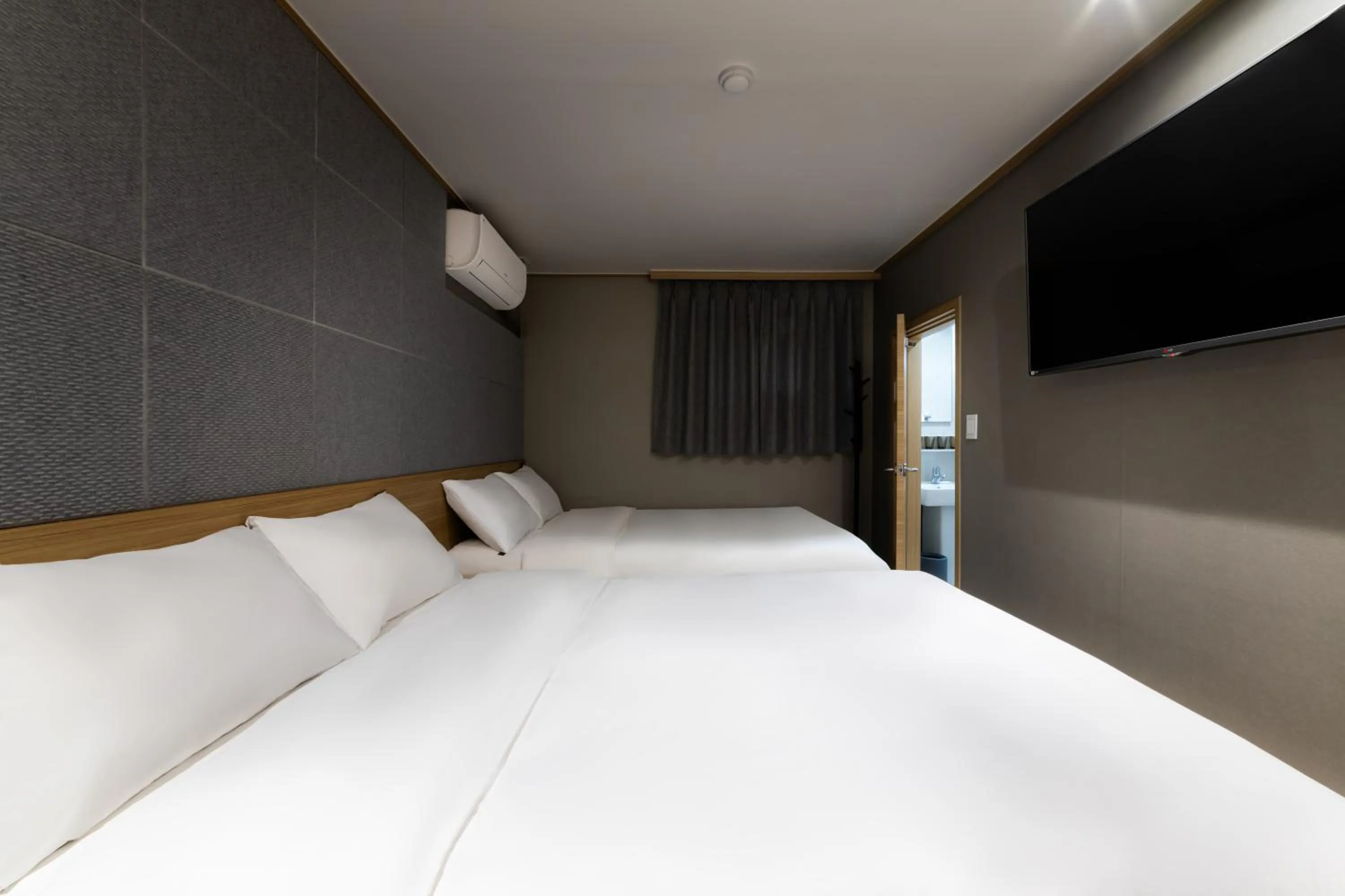 Bed in About Stay Seoul