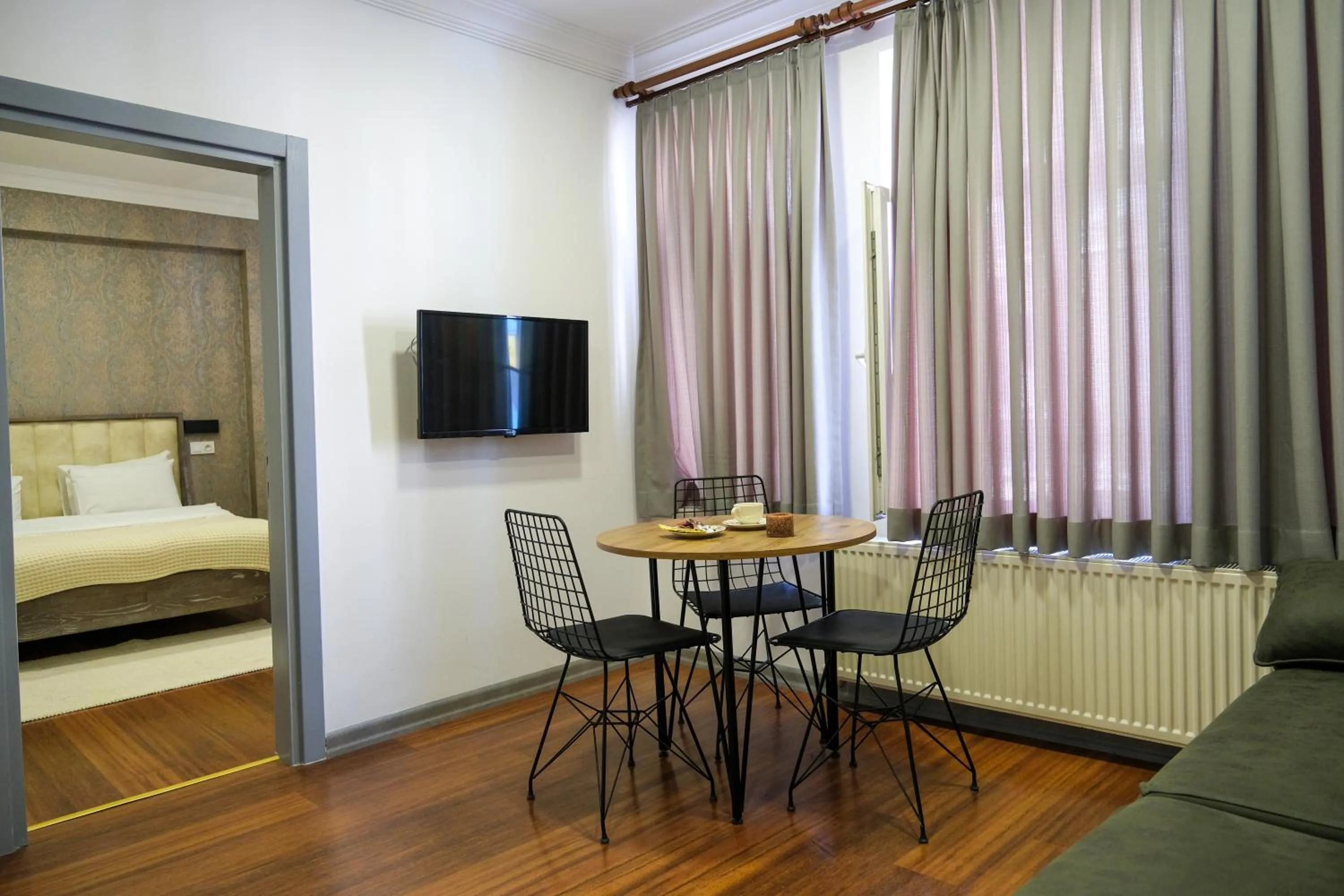 Communal lounge/ TV room, Bed in Taksim Neo Pera Suites