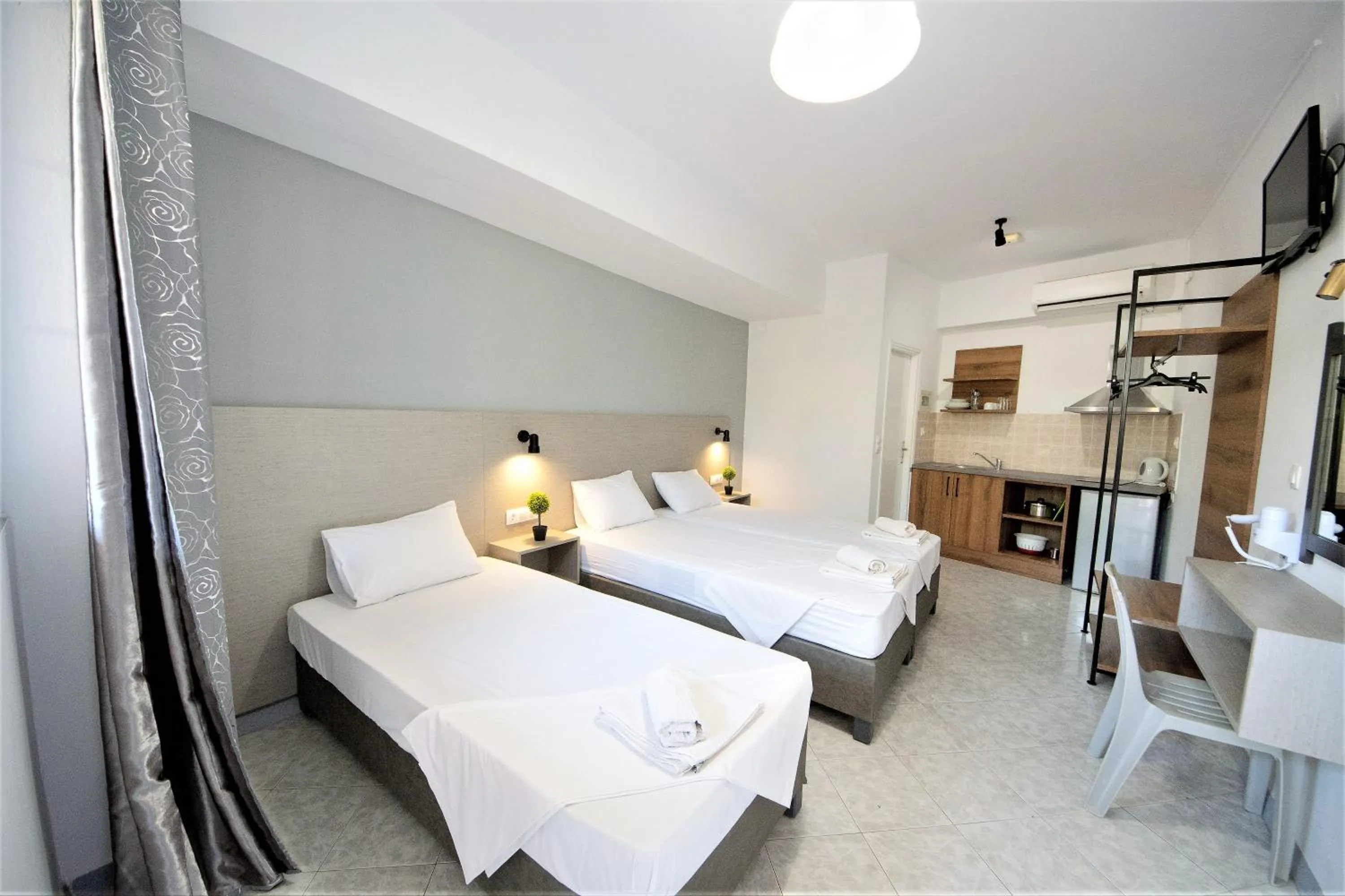 Kitchen or kitchenette, Bed in Nikos Villas