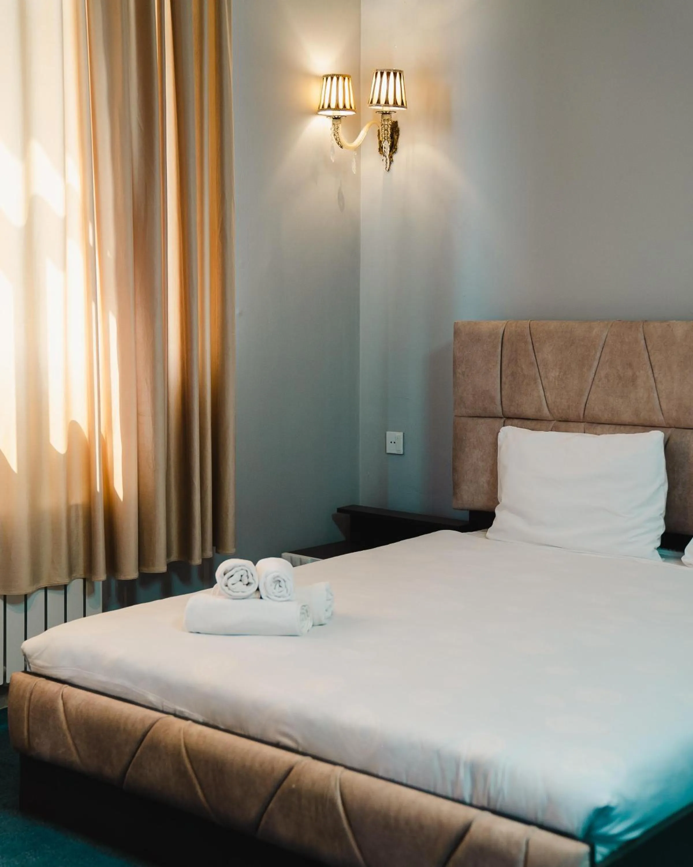 Bed in Olive Garden Baku Hotel