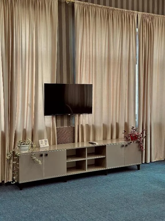 Communal lounge/ TV room in Olive Garden Baku Hotel