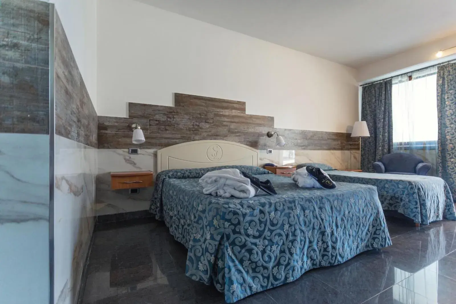 Triple Room in Hotel San Luca Triple Room in Hotel San Luca