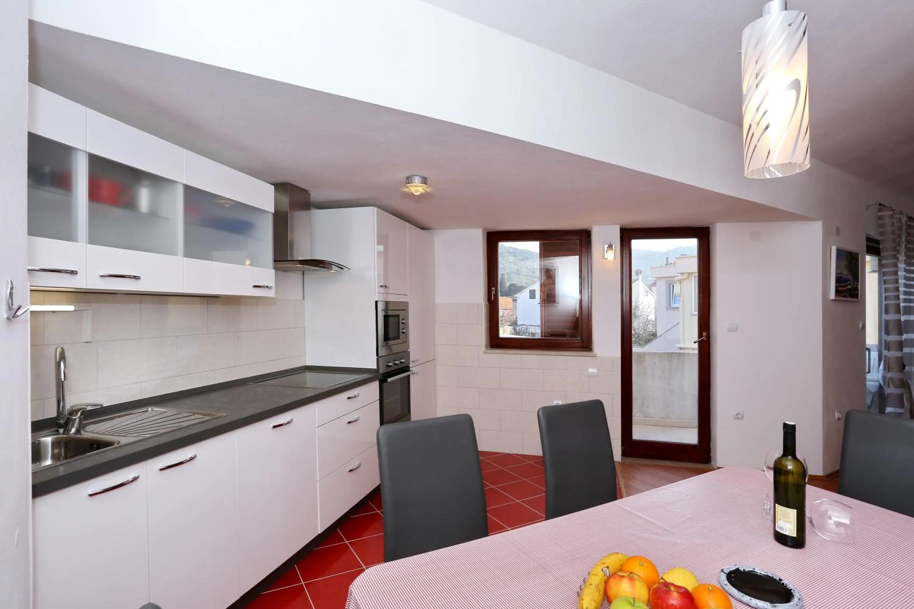 Kitchen or kitchenette in Apartments Maslina Božava
