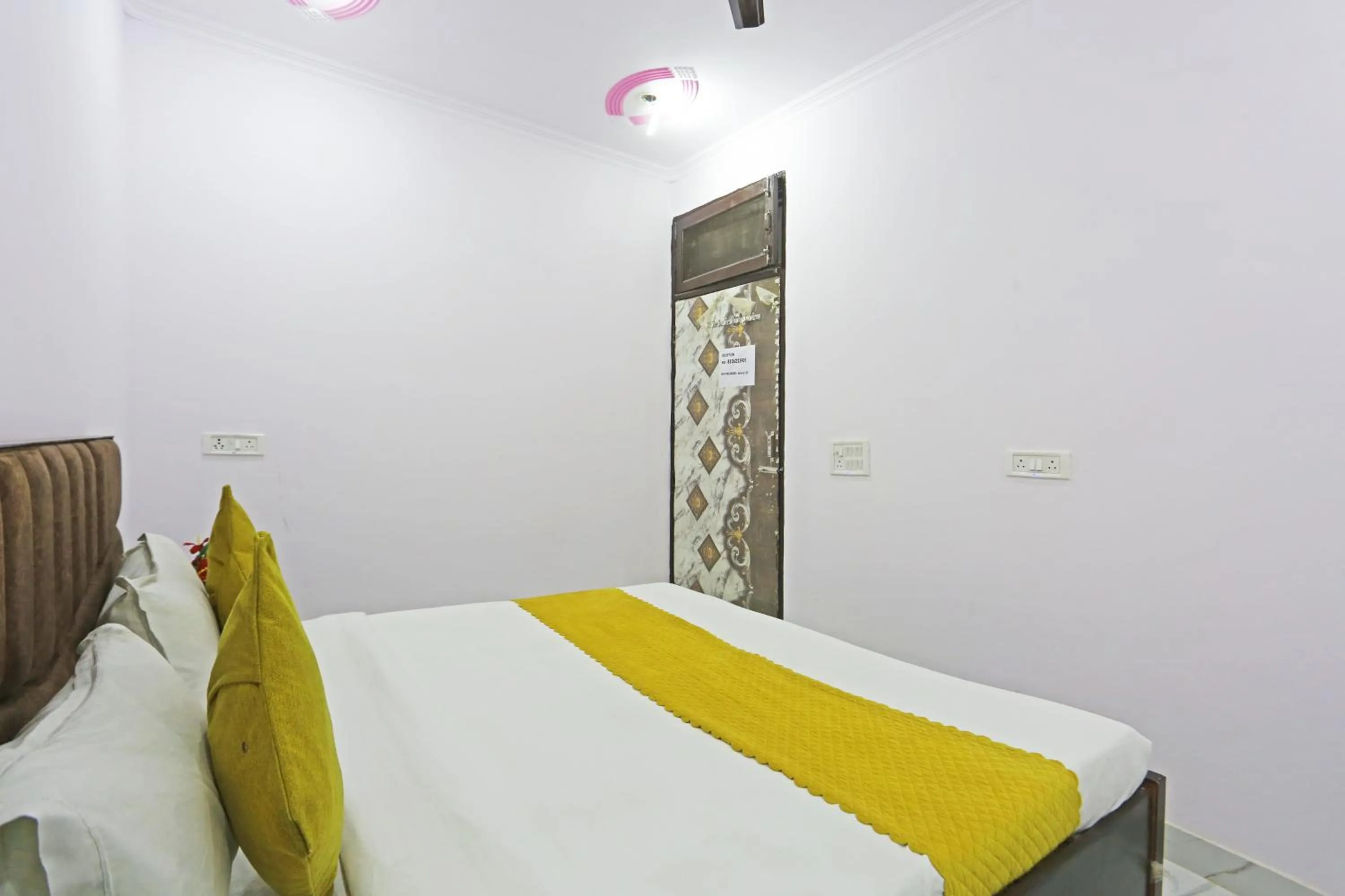 Bed in Twamev Residency