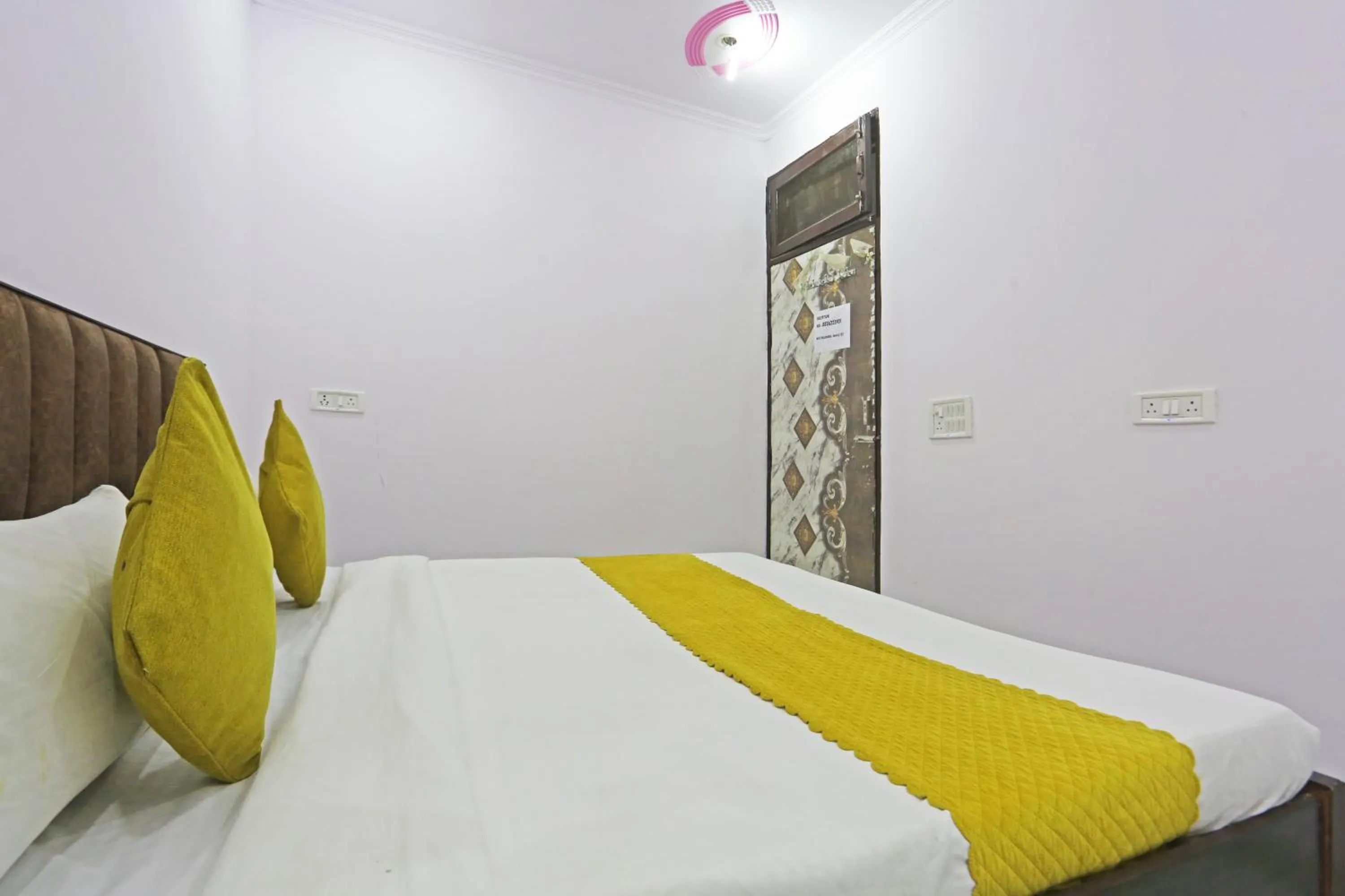 Bed in Twamev Residency