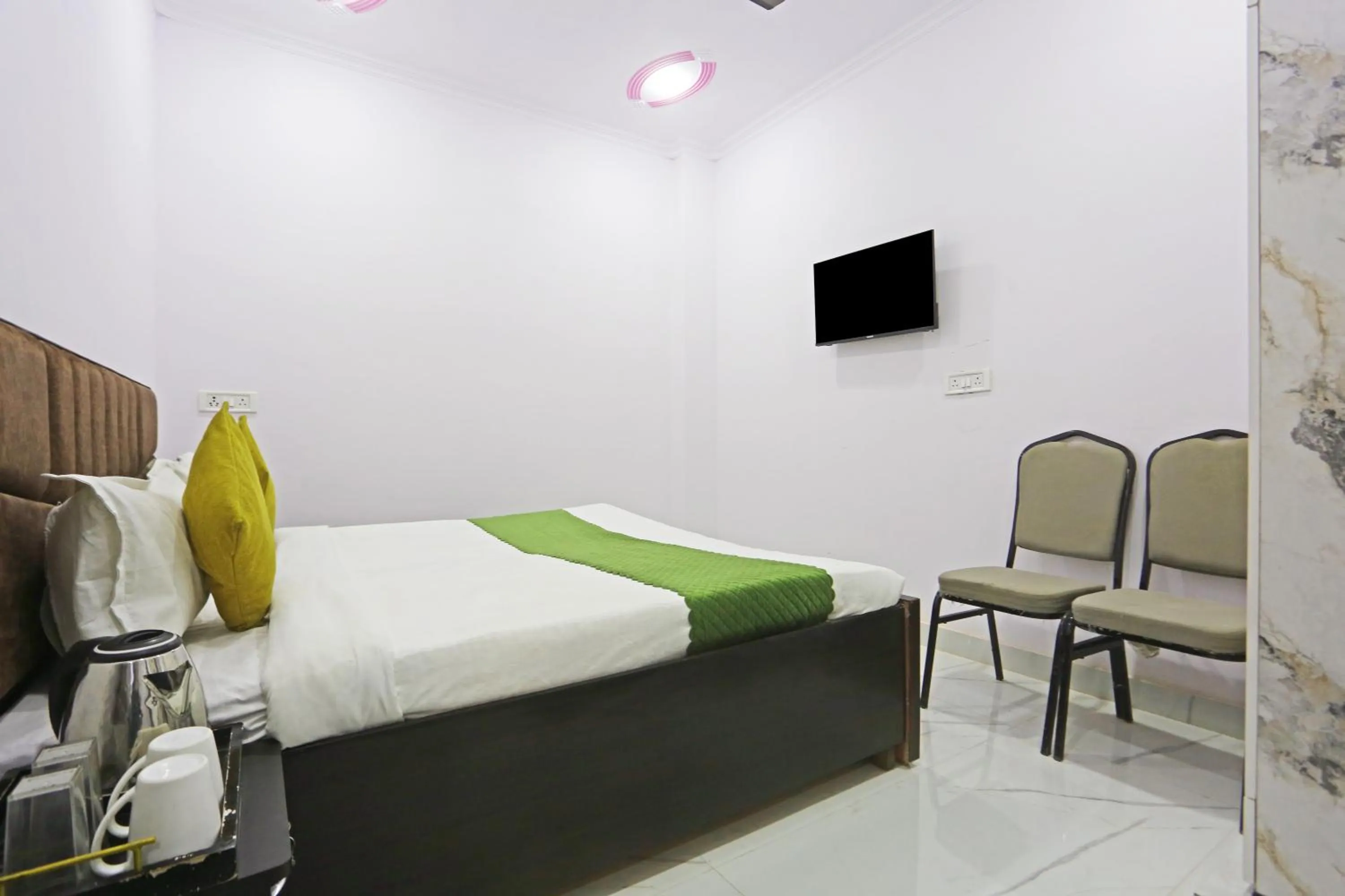 Bed in Twamev Residency