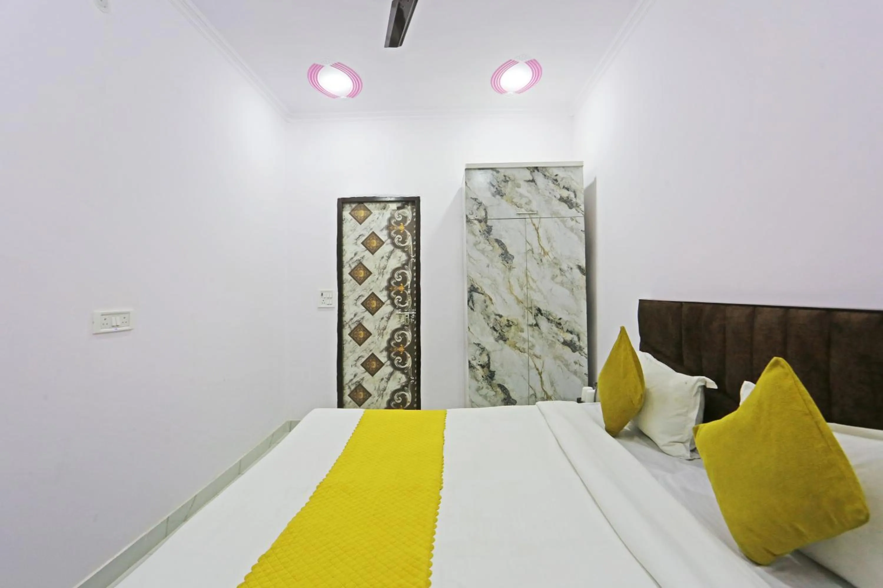 Bed in Twamev Residency