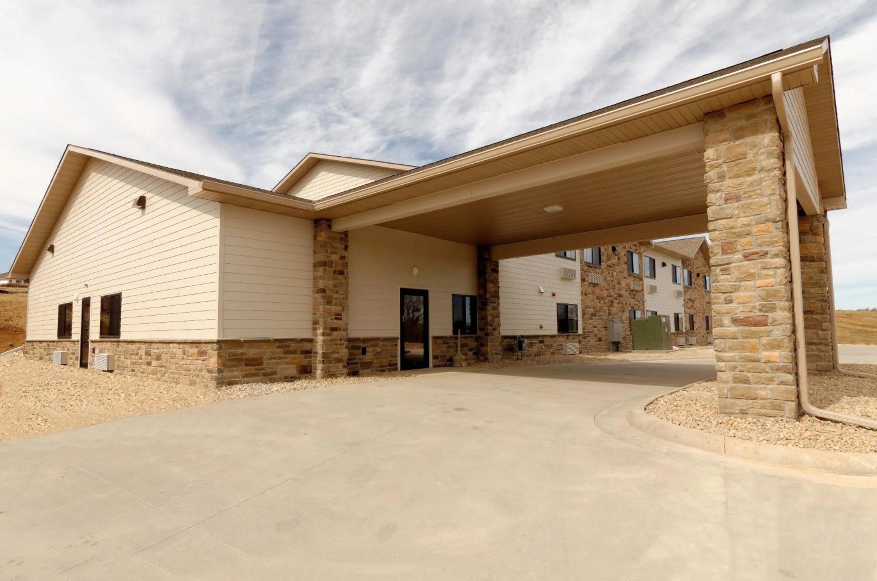 Property building in Cobblestone Inn & Suites - Denison | Oak Ridge