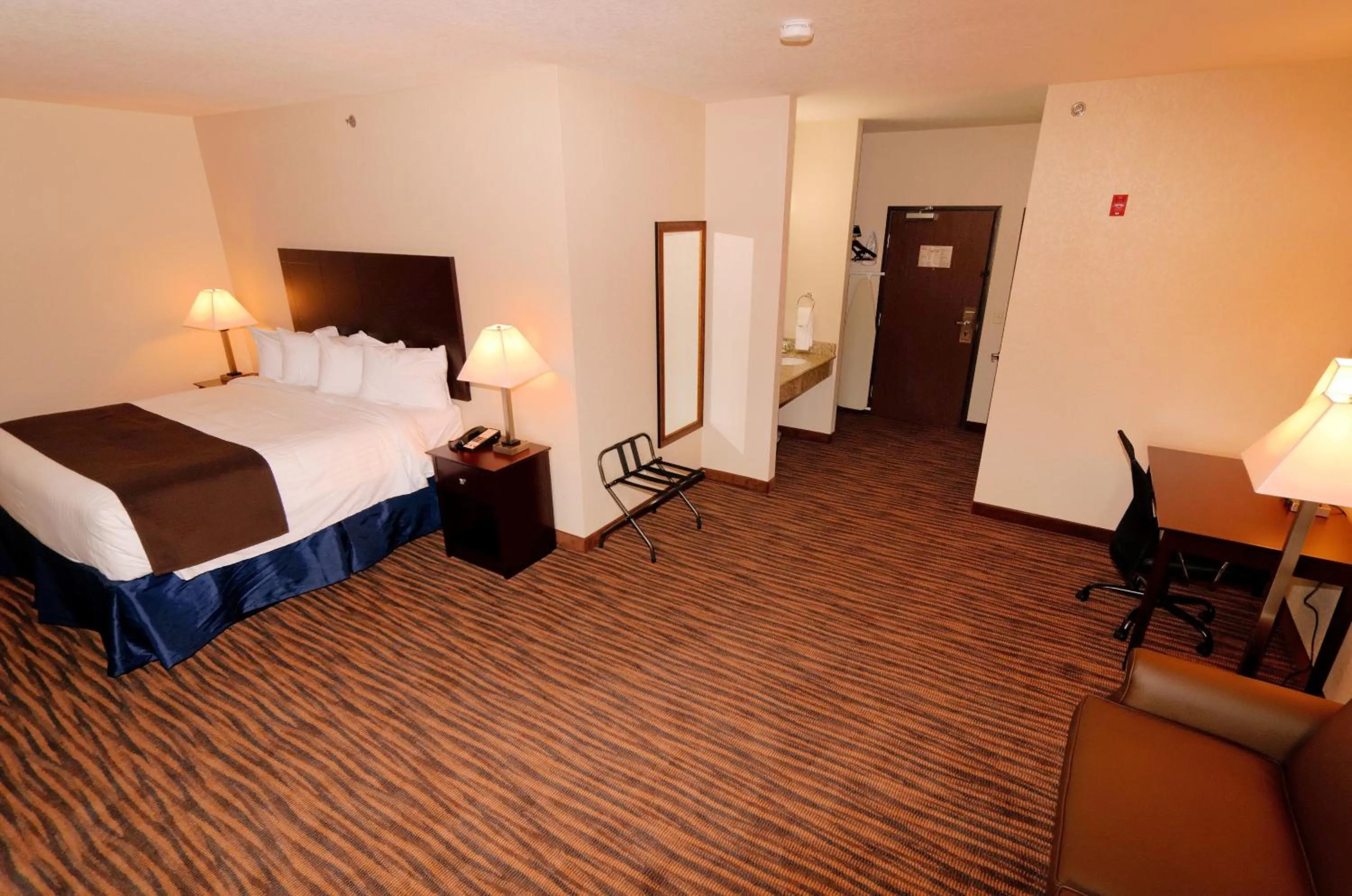 Bed in Cobblestone Inn & Suites - Denison | Oak Ridge