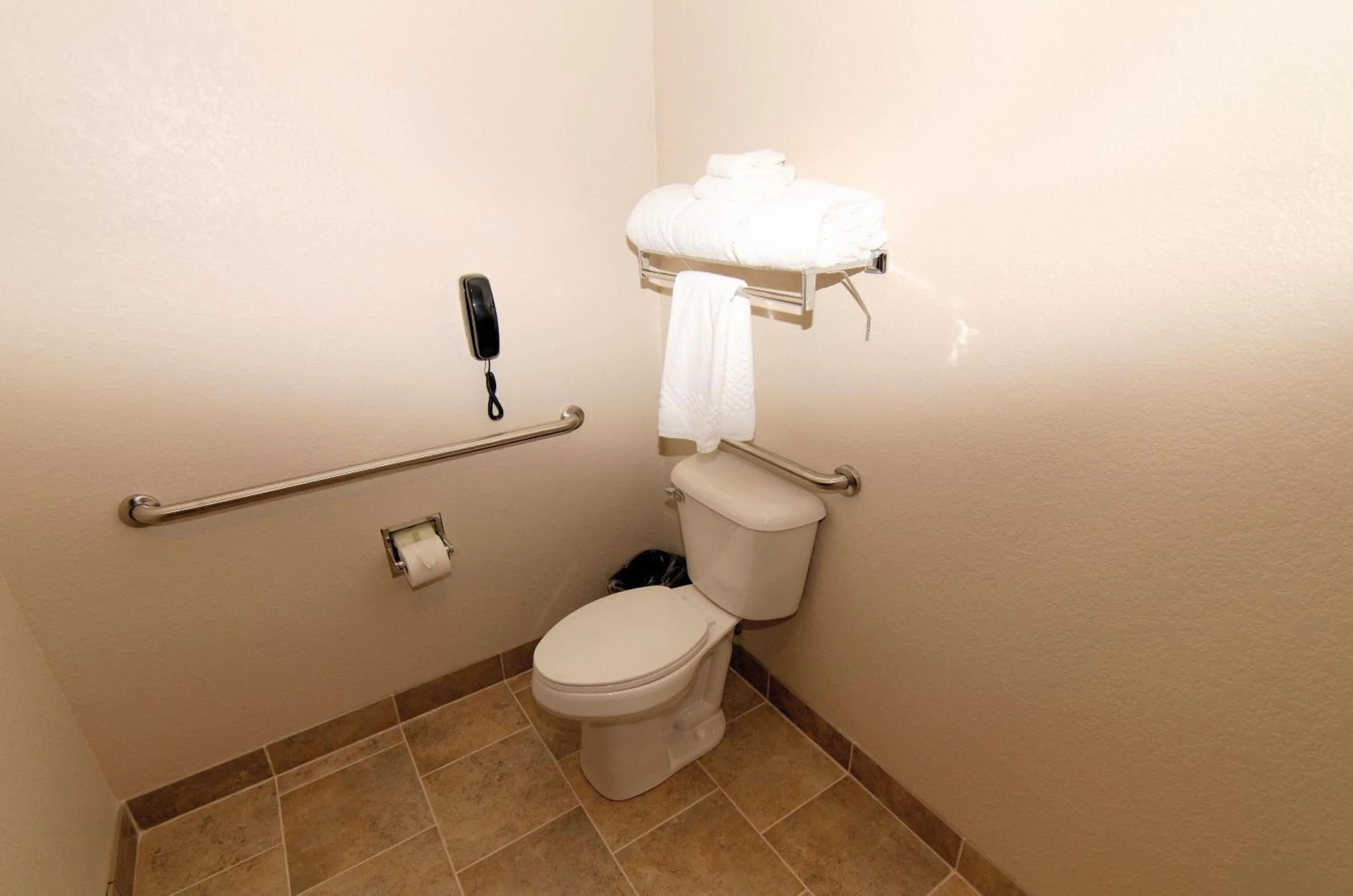 Toilet in Cobblestone Inn & Suites - Denison | Oak Ridge