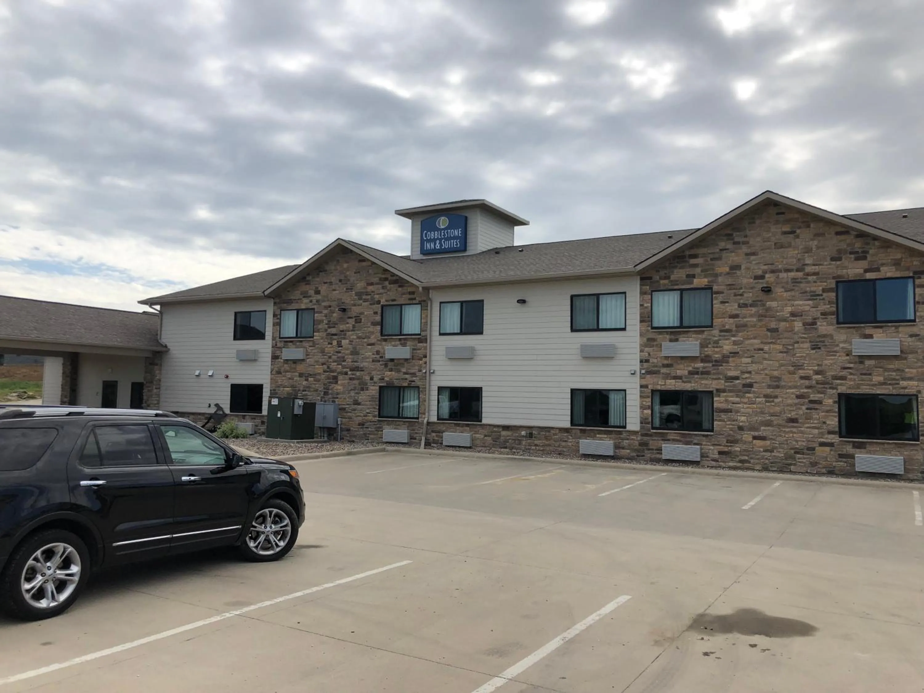 Property building in Cobblestone Inn & Suites - Denison | Oak Ridge