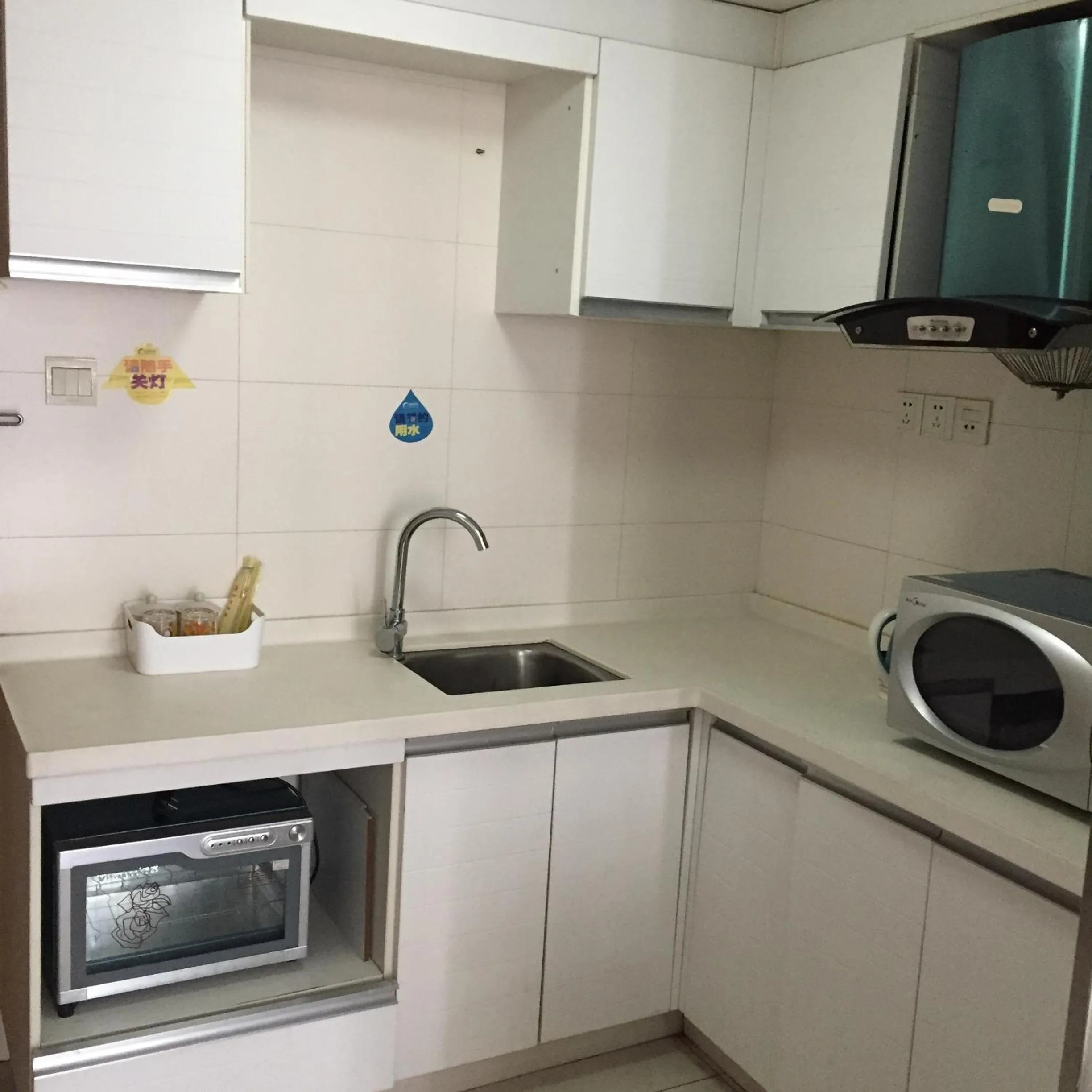 Kitchen or kitchenette in Meiru Apartment Hotel Guangzhou Bolin Apartment