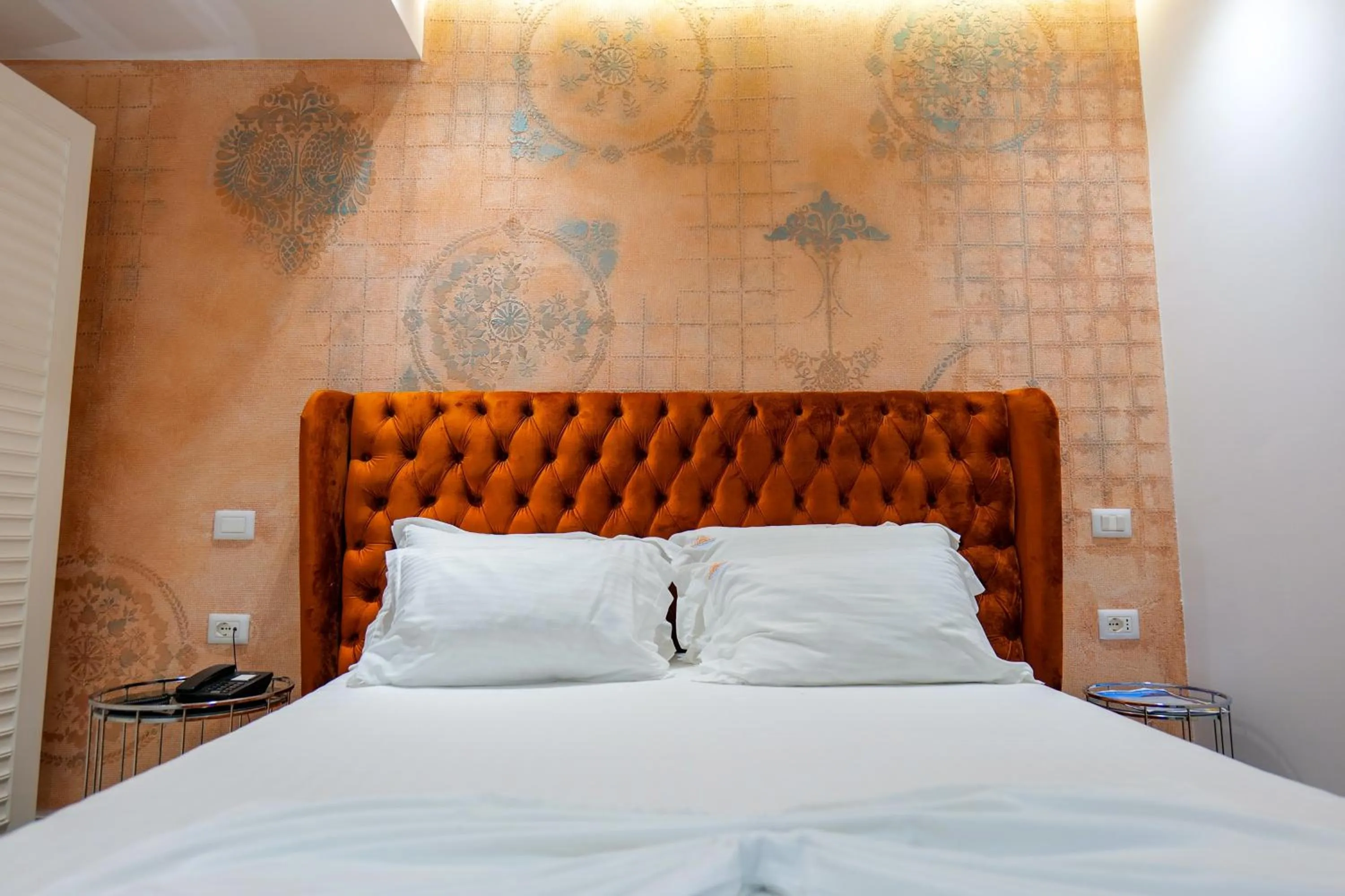 Bed in HH Boutique Hotel