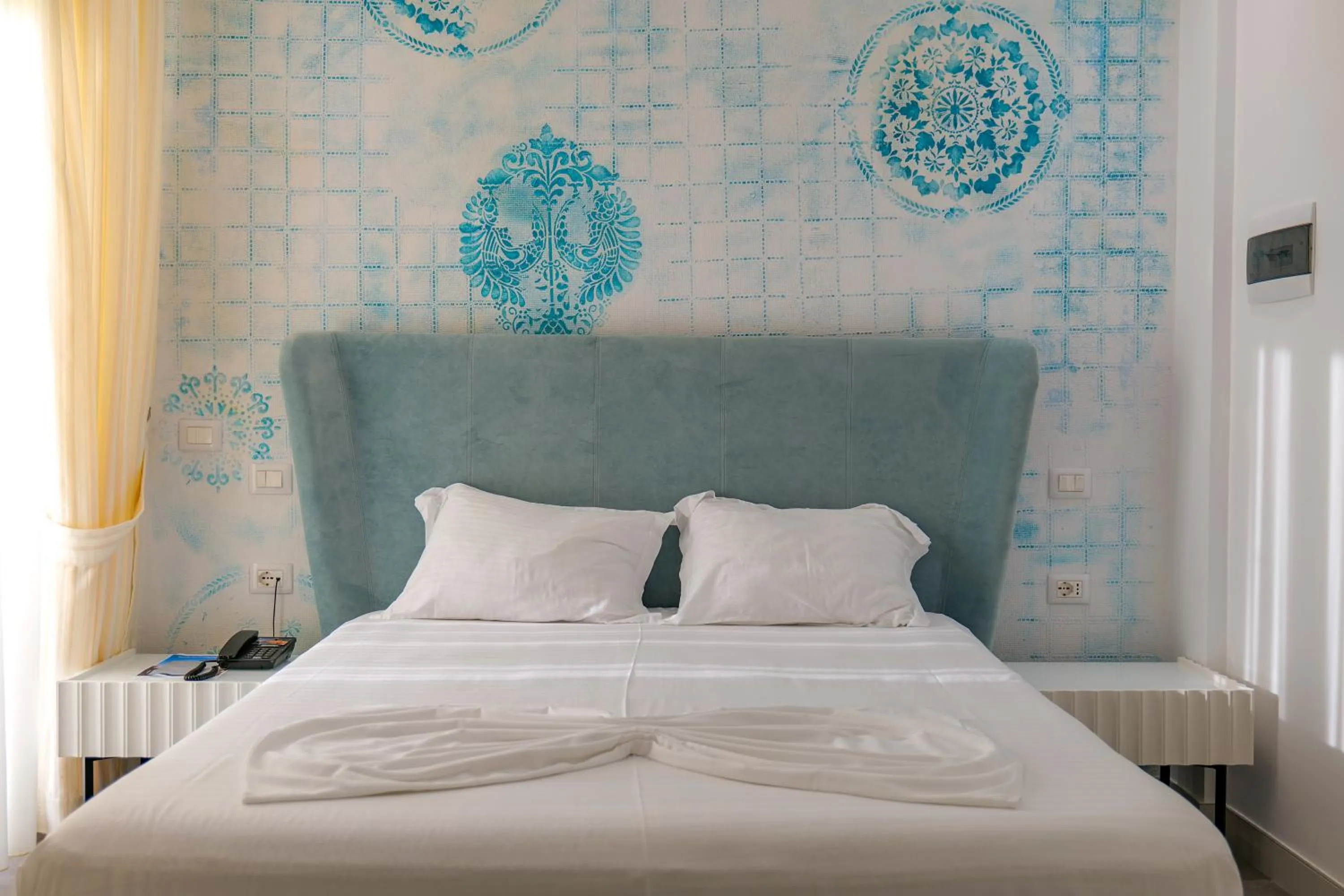 Bed in HH Boutique Hotel