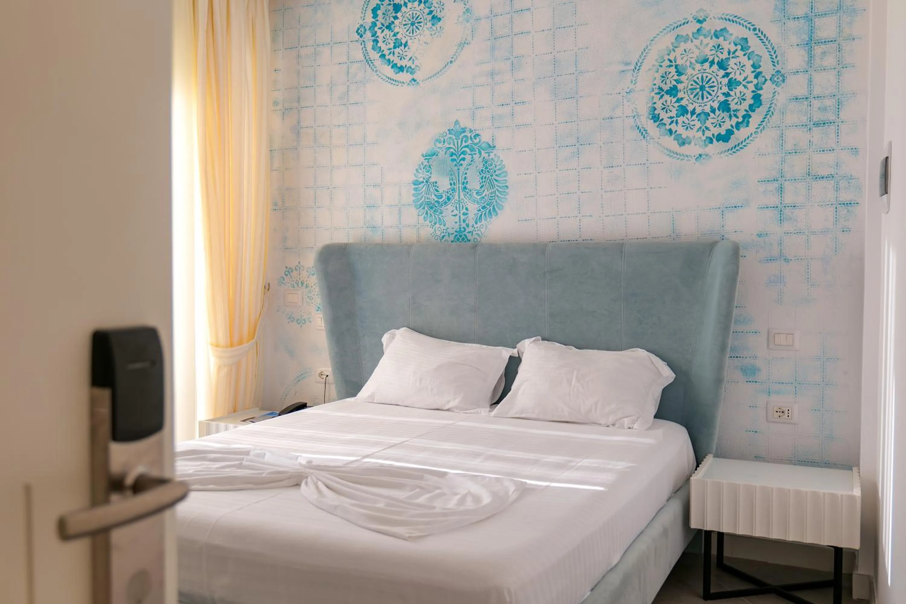 Bed in HH Boutique Hotel