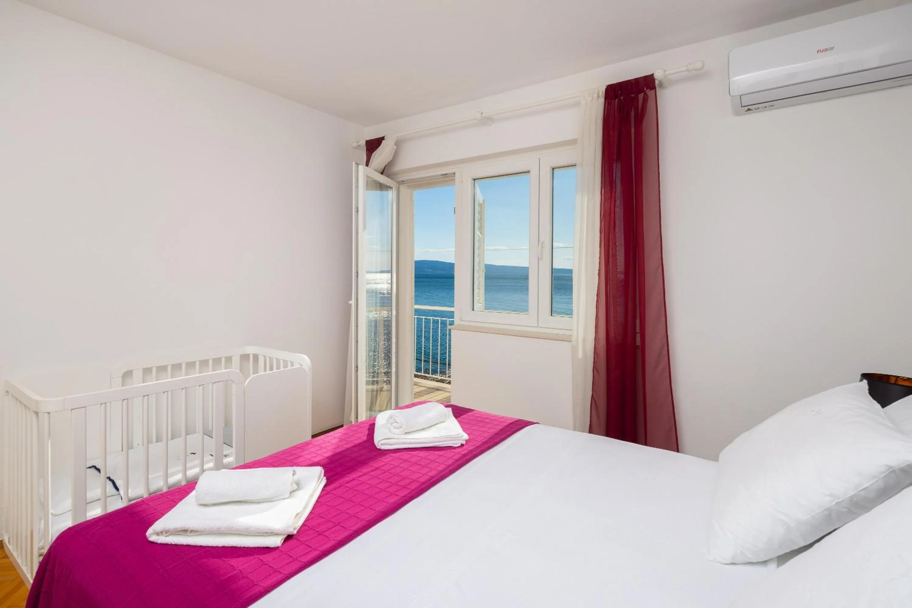 Bed in Seaside Apartment Blue