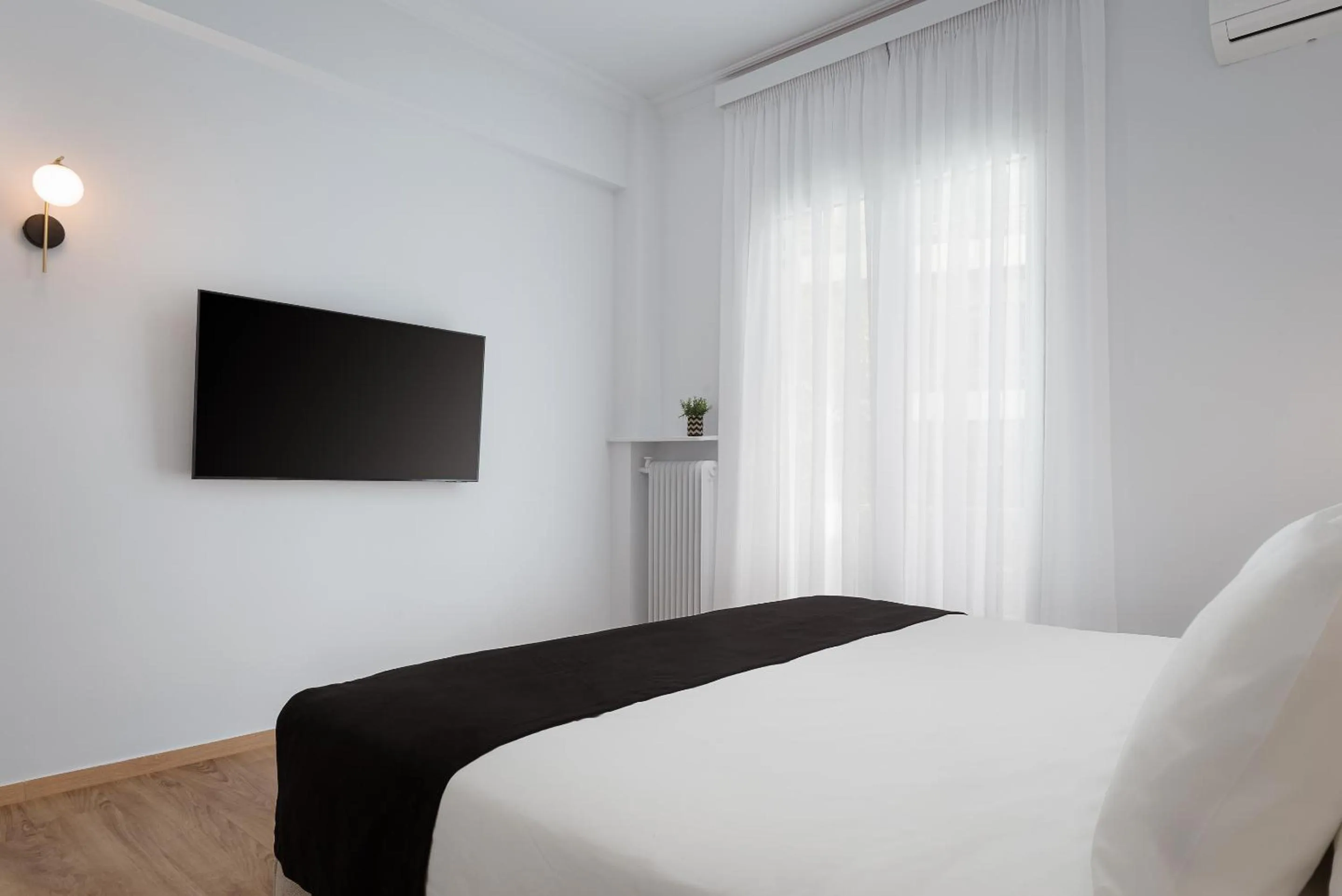 Bed in Acropolis Classy Apartments