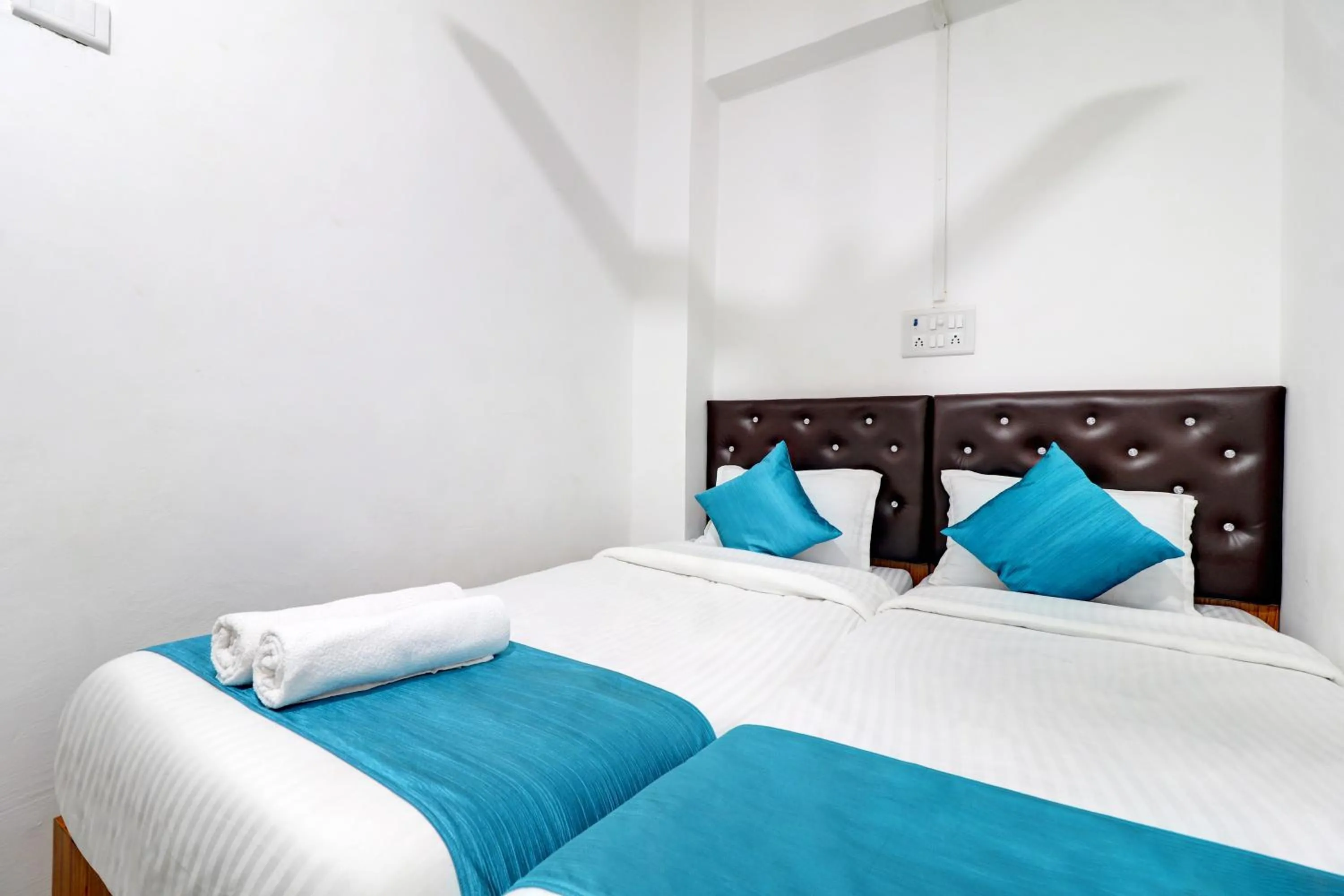 Bed in Raksha Residency