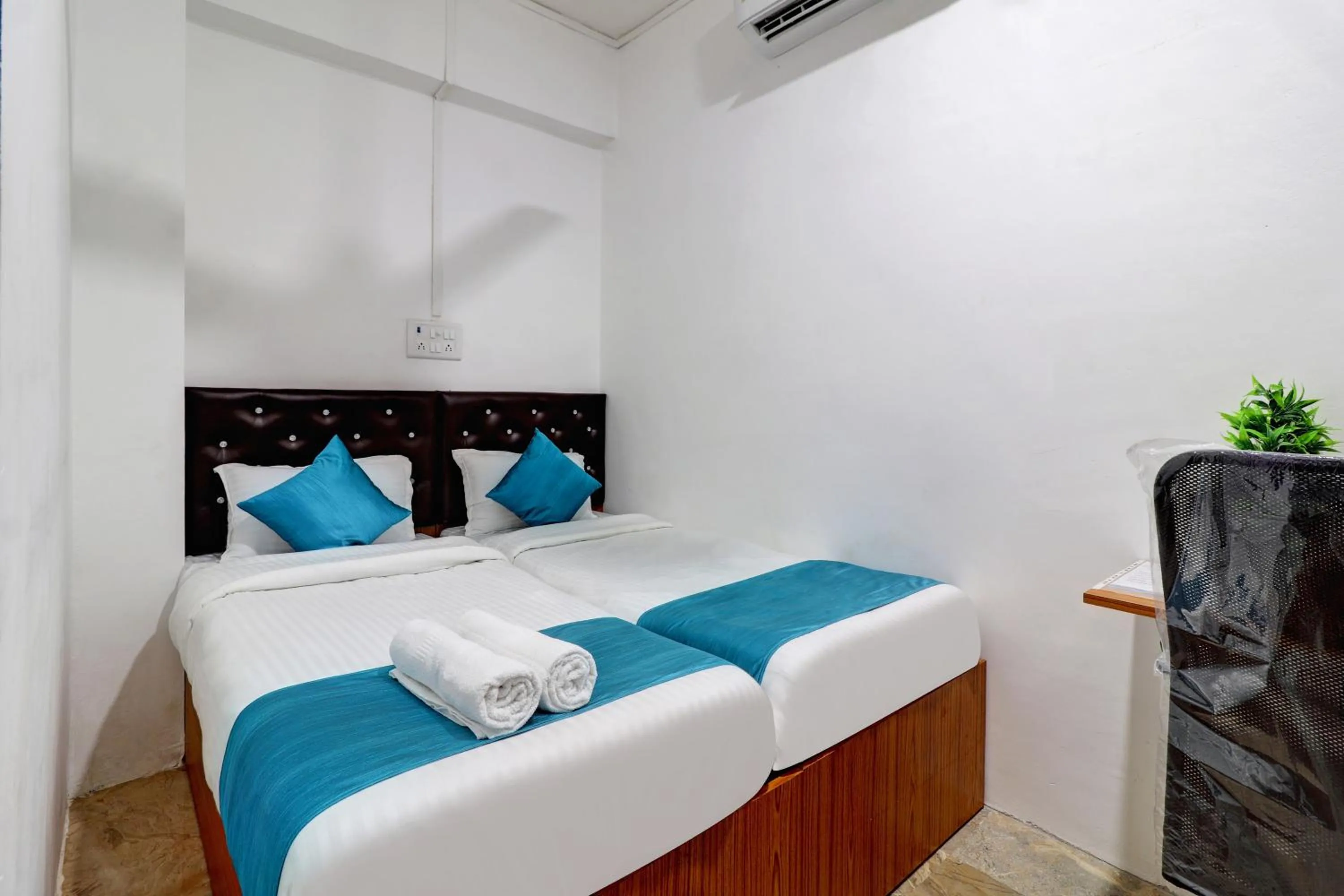 Bed in Raksha Residency