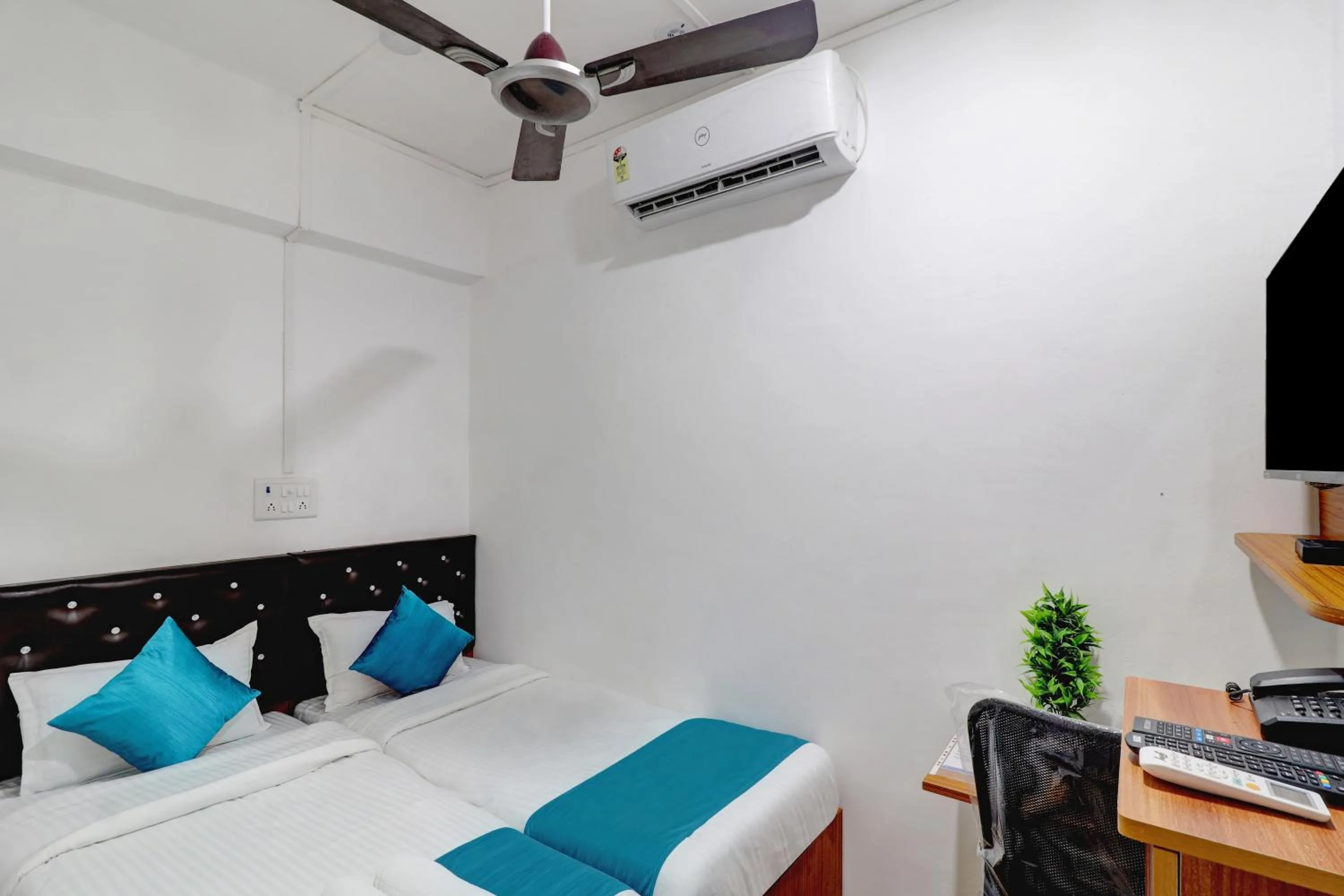 Bed in Raksha Residency
