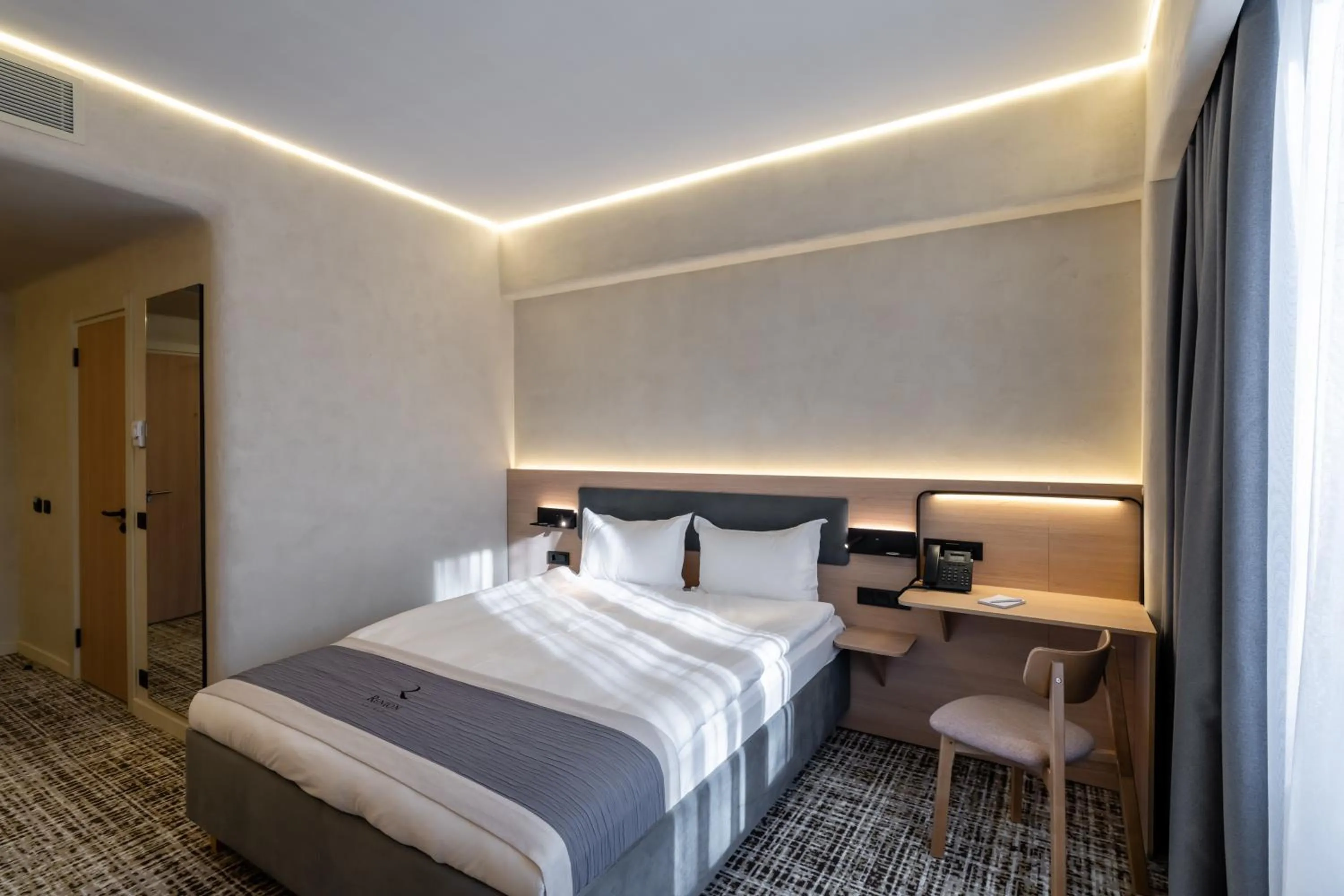 Bed in Renion City Hotel