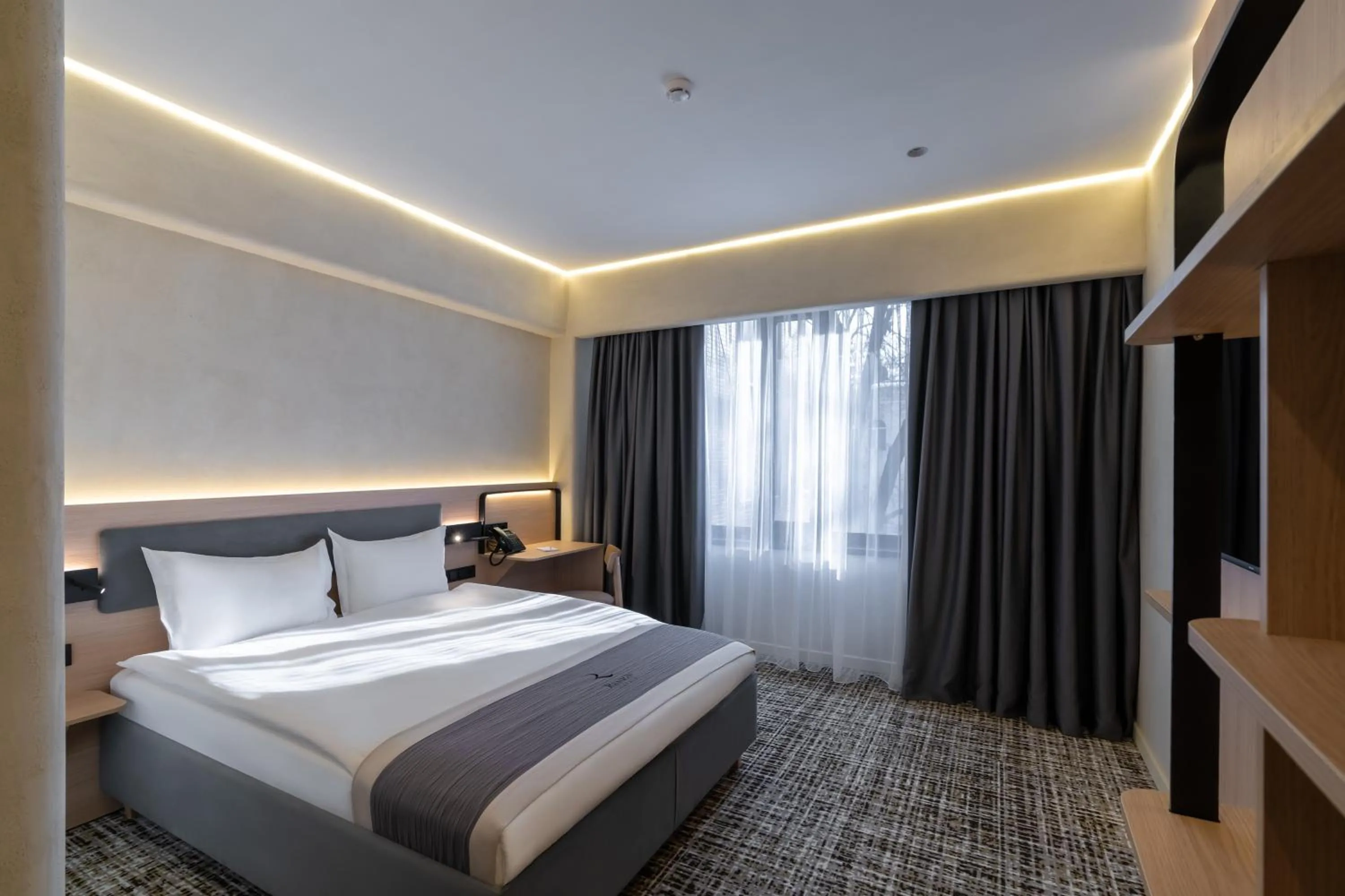 Bed in Renion City Hotel