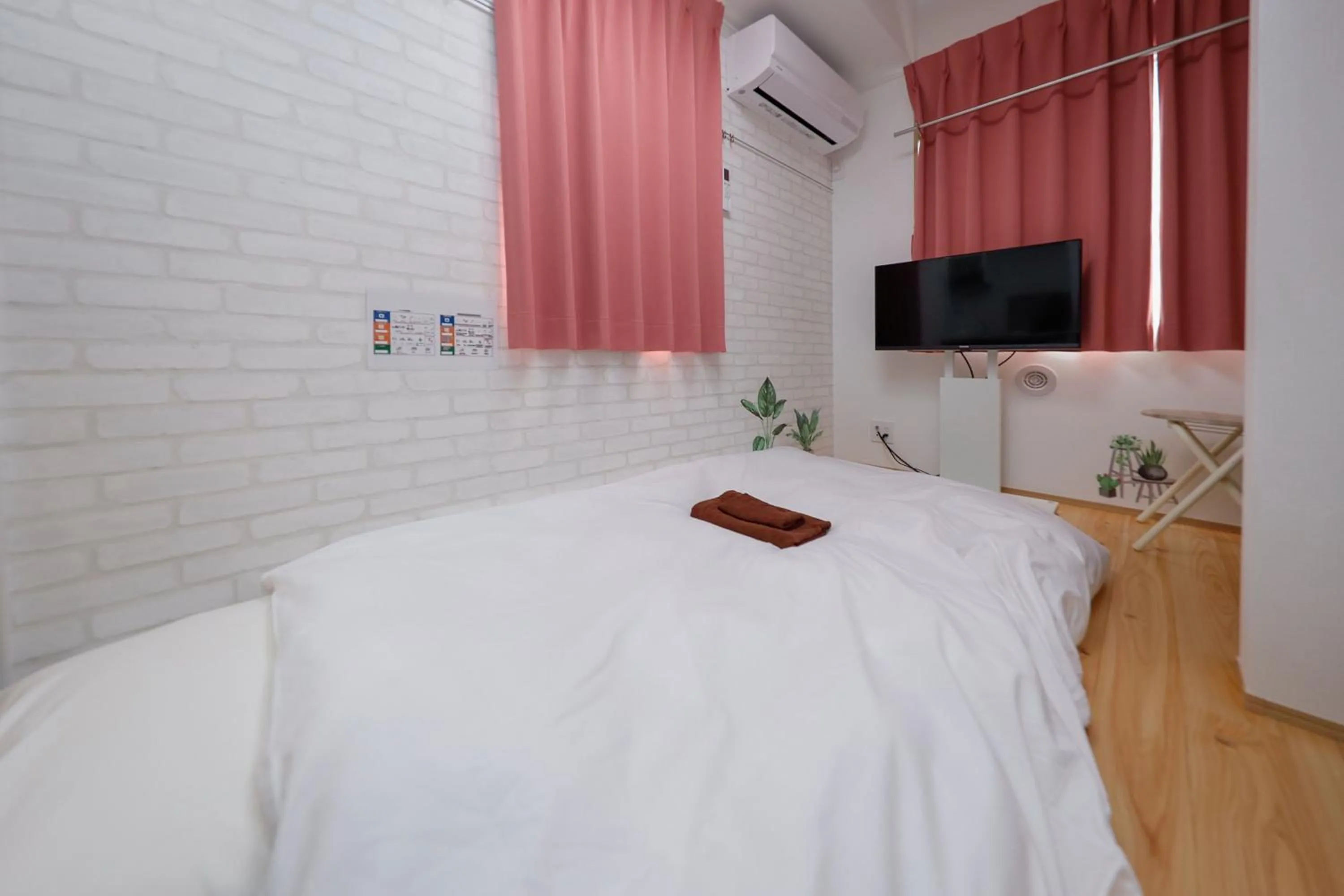 Bed in Zenith Shinjuku Hinoki by Tranova