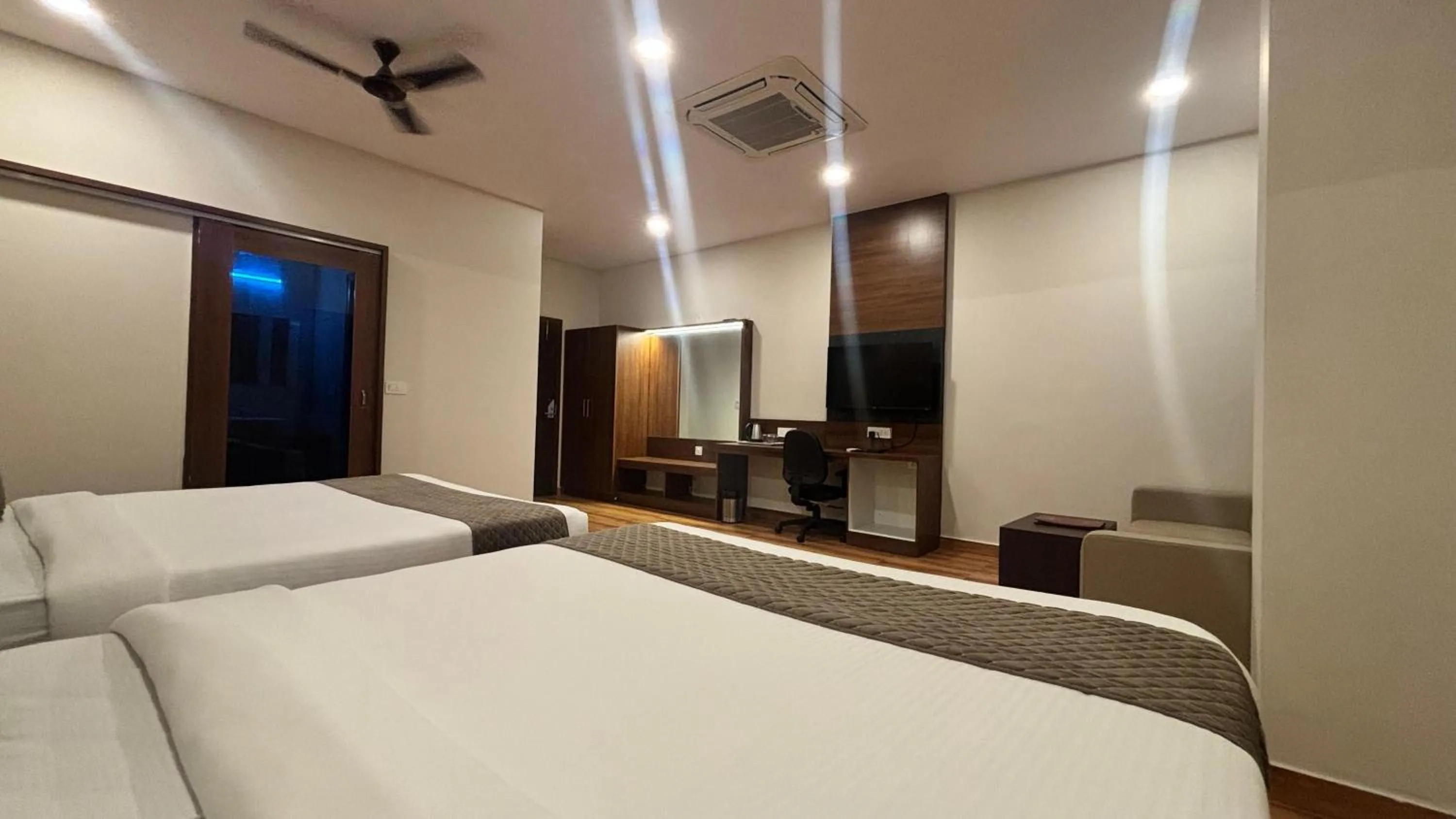 Bed in Hotel Kalyan Suites