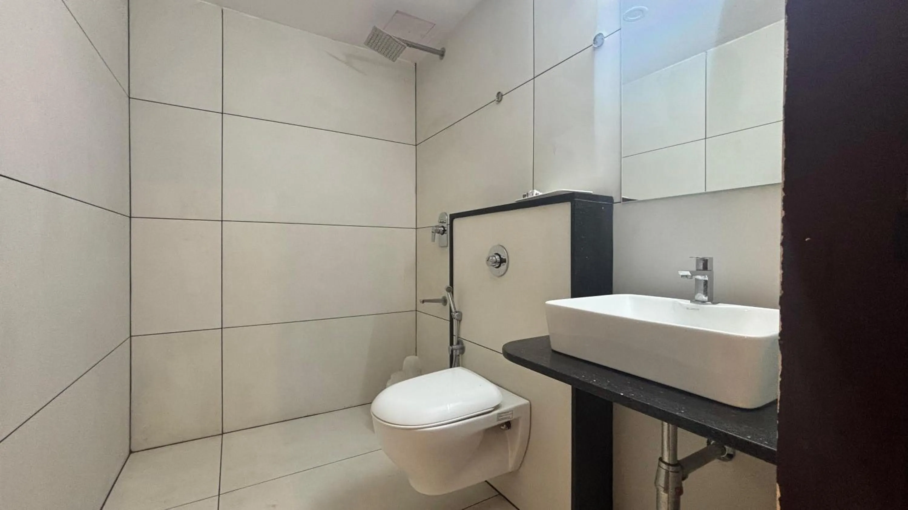 Shower in Hotel Kalyan Suites