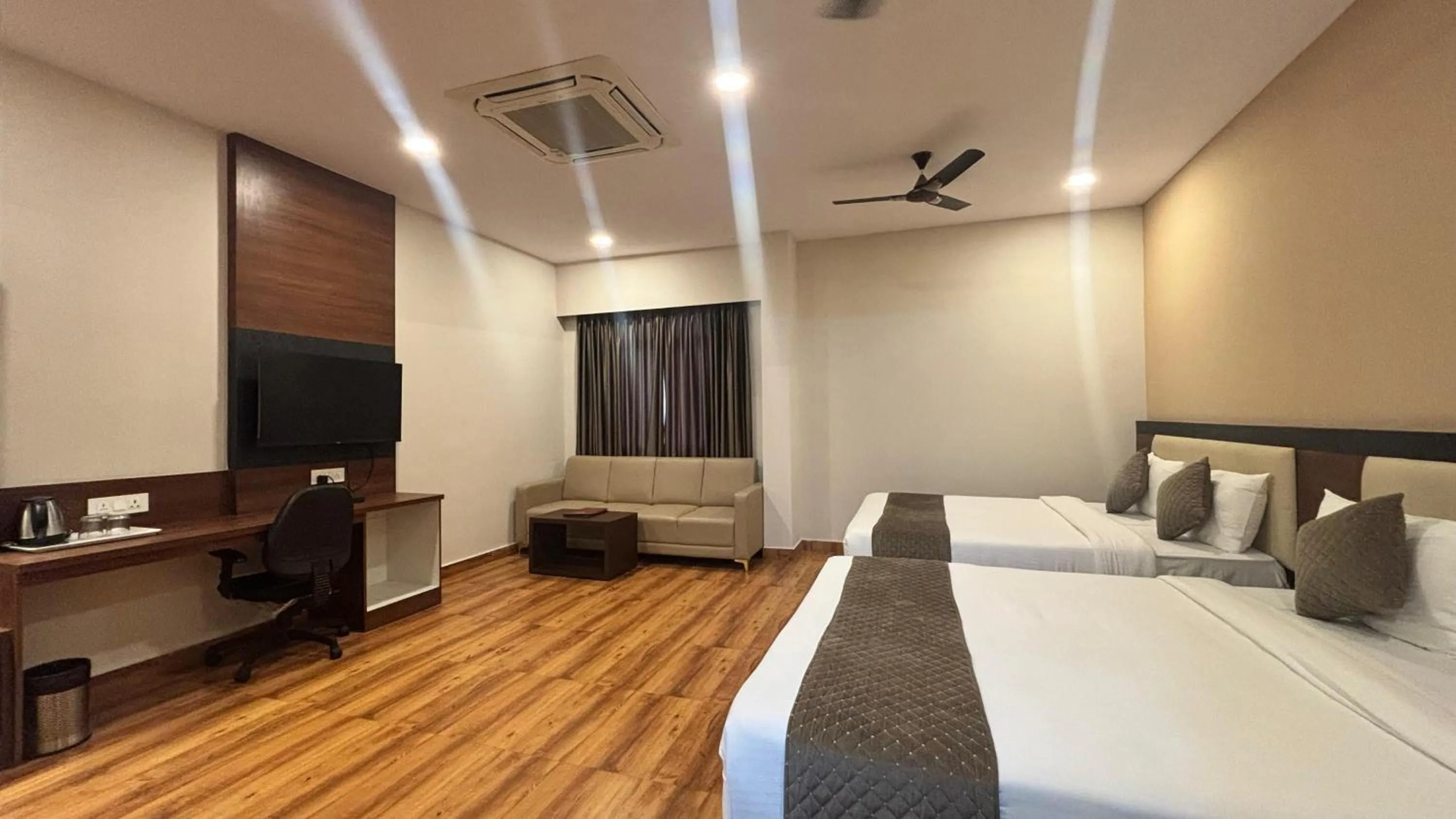 Bed in Hotel Kalyan Suites