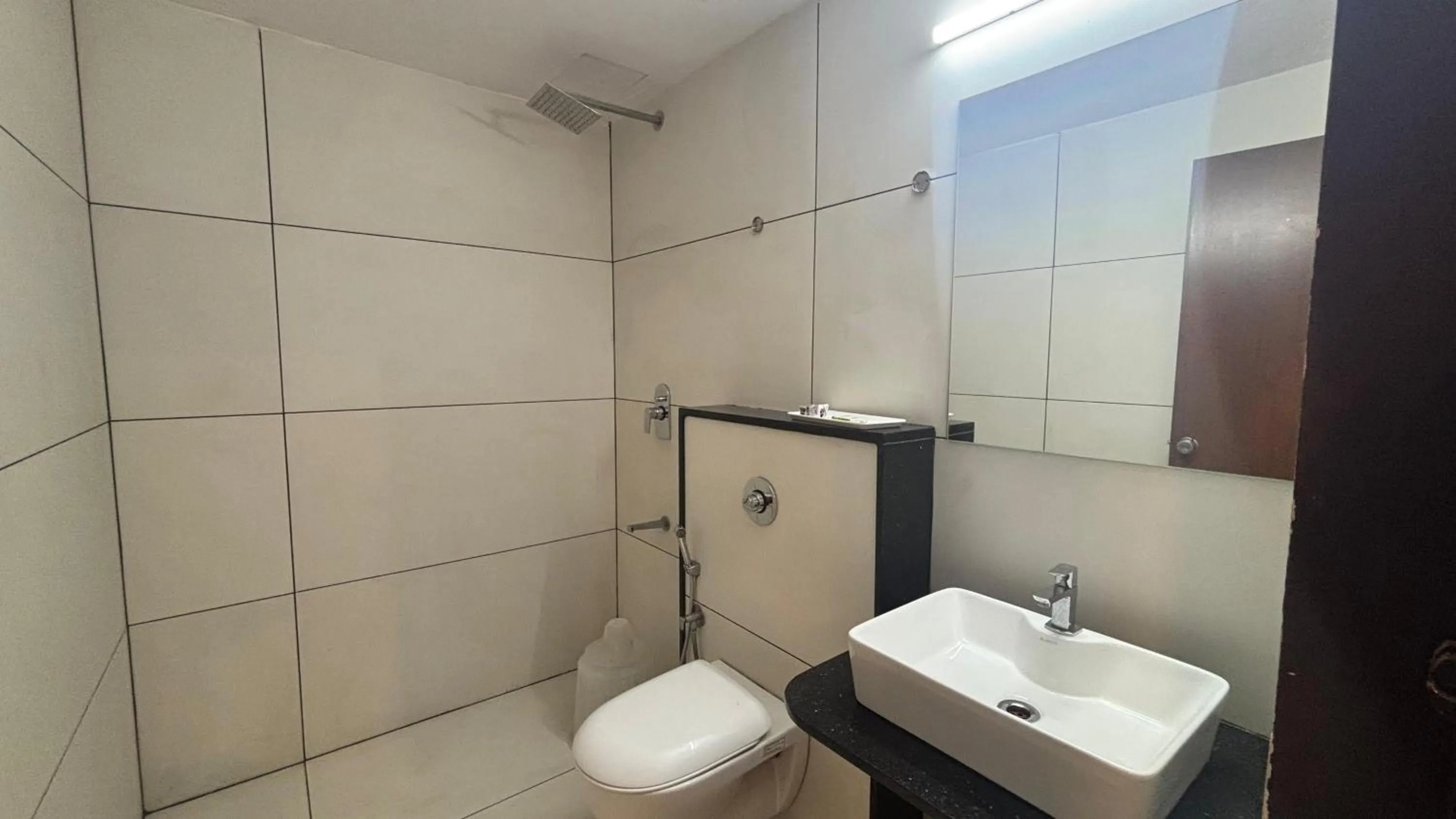 Shower in Hotel Kalyan Suites