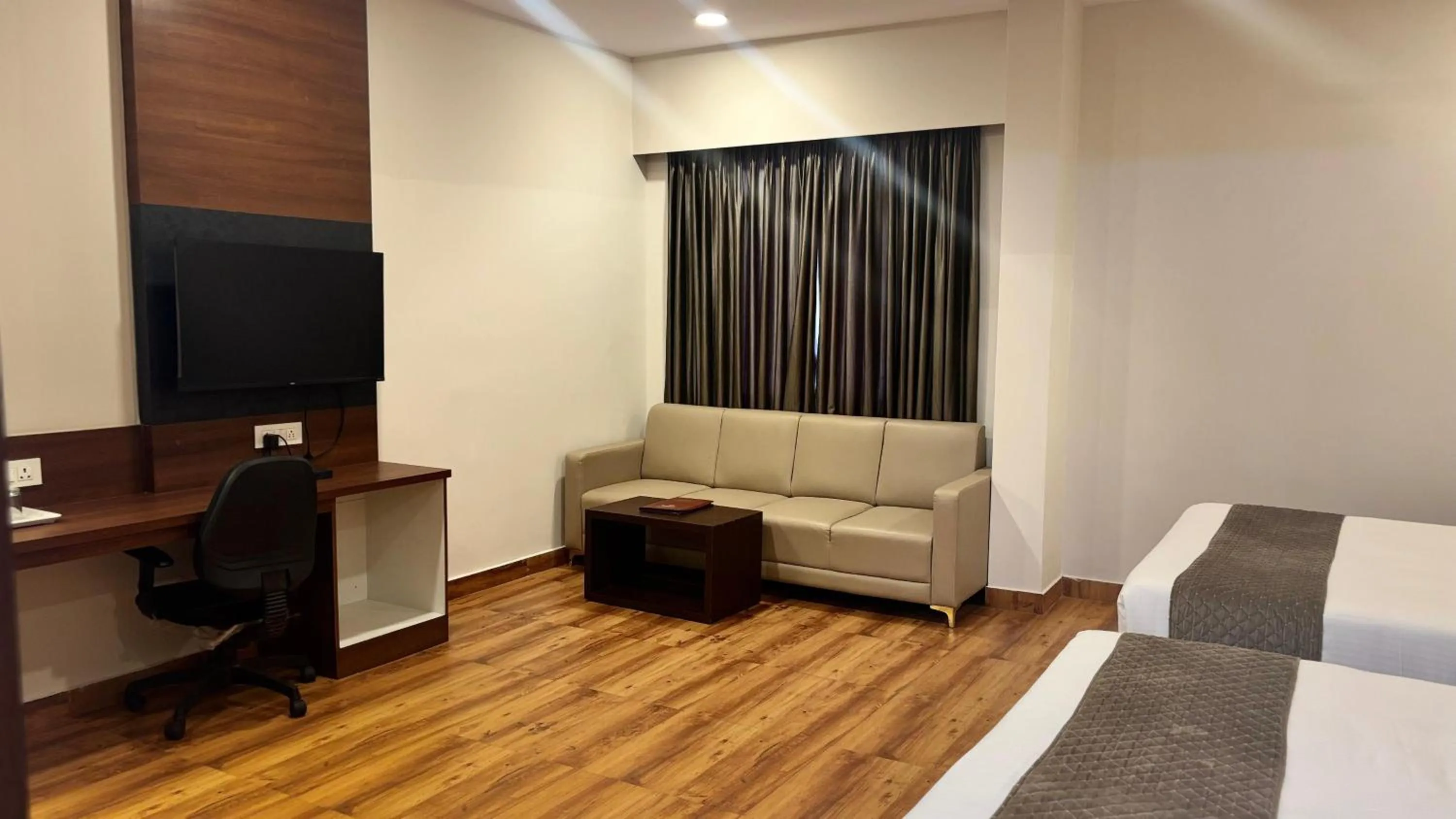 Bed in Hotel Kalyan Suites