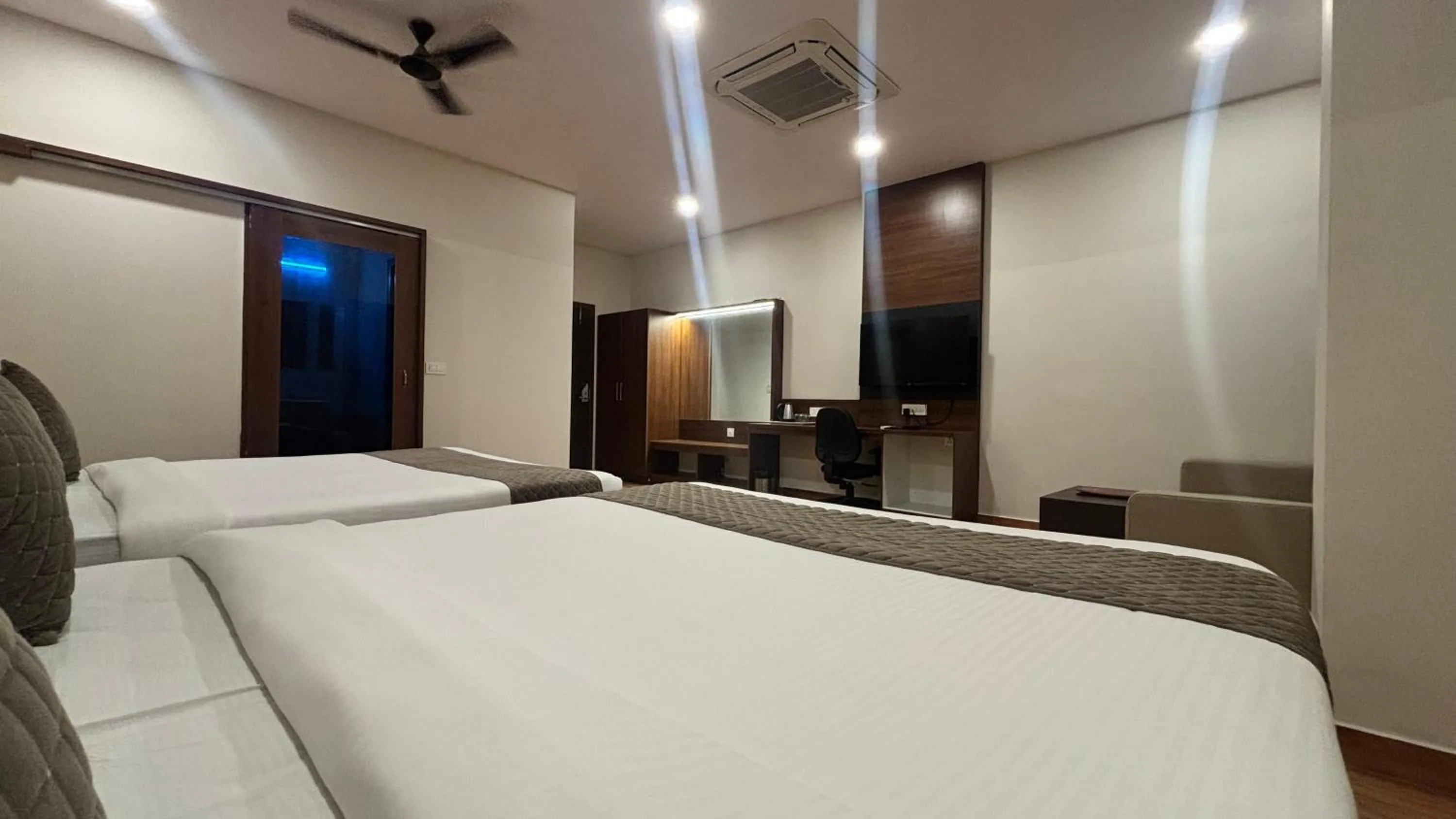 Bed in Hotel Kalyan Suites